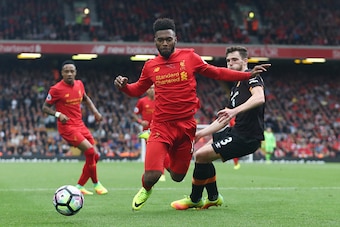 LIVERPOOL, ENGLAND - SEPTEMBER 24:  Daniel Sturridge of Liverpoo (L)l is fouled by Andrew Robertson of Hull City (R) for a penalty during the Premier League match between Liverpool and Hull City at Anfield on September 24, 2016 in Liverpool, England.  (Ph