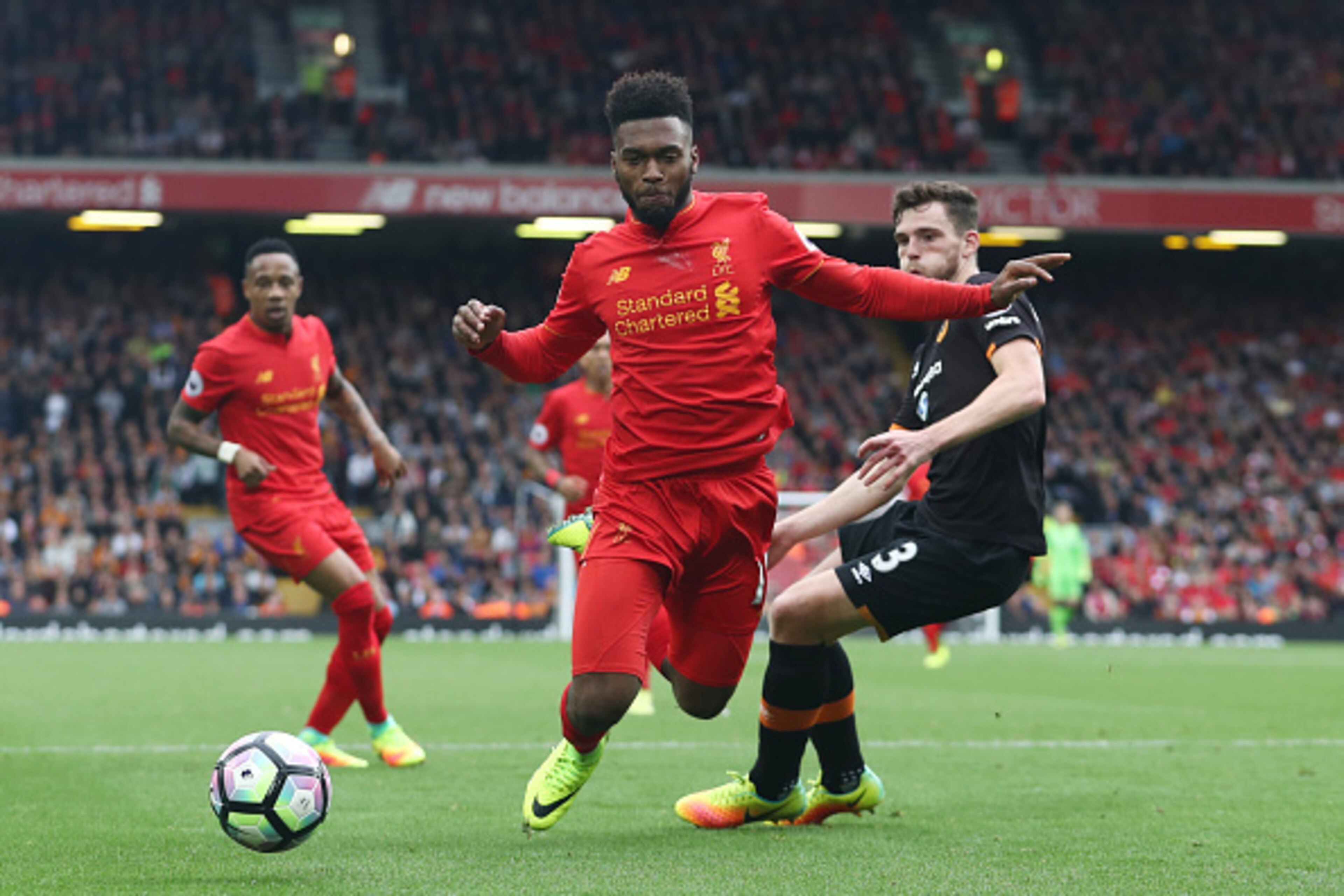 LIVERPOOL, ENGLAND - SEPTEMBER 24:  Daniel Sturridge of Liverpoo (L)l is fouled by Andrew Robertson of Hull City (R) for a penalty during the Premier League match between Liverpool and Hull City at Anfield on September 24, 2016 in Liverpool, England.  (Ph