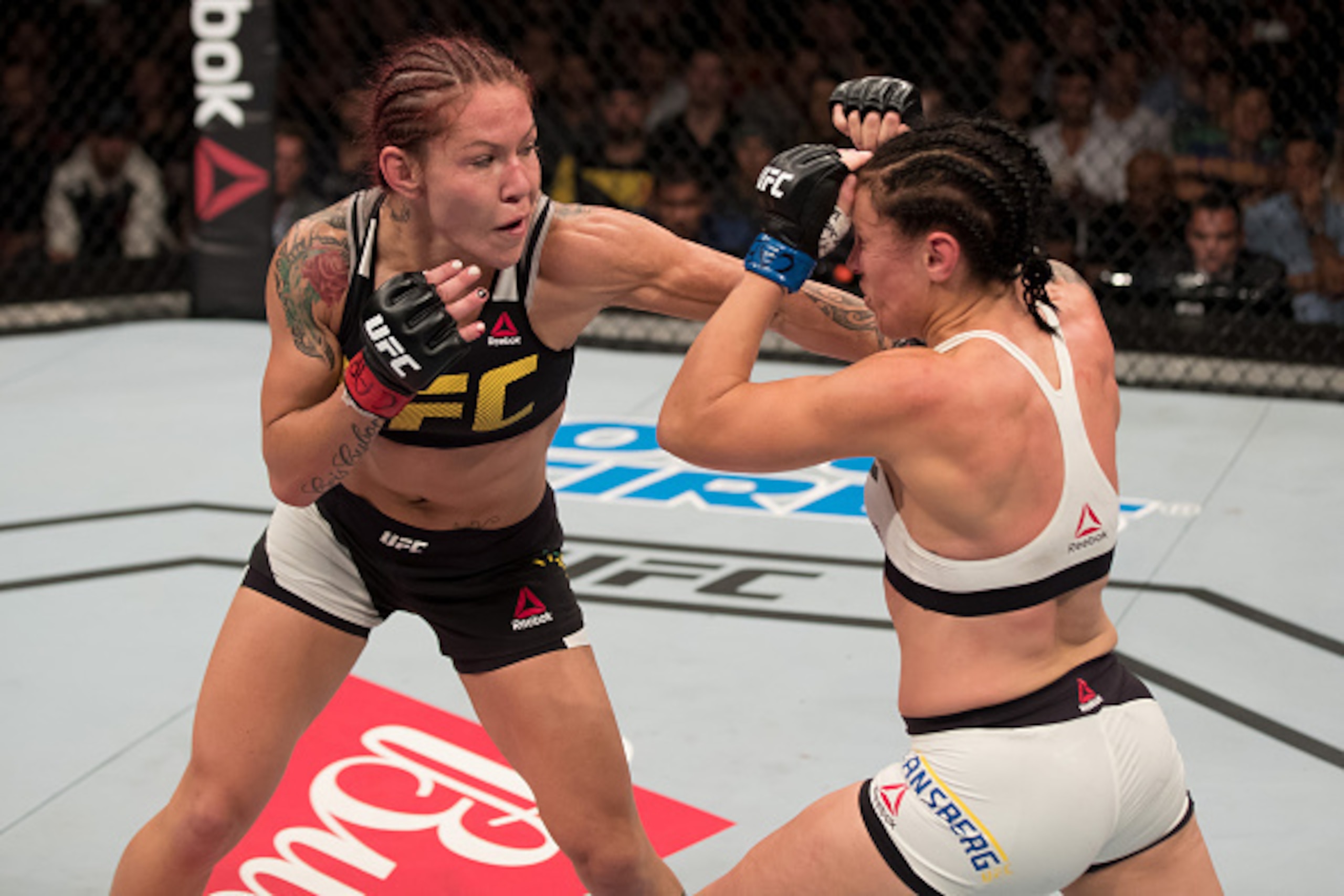 BRASILIA, BRAZIL - SEPTEMBER 24: Cris Cyborg of Brazil punches Lina Lansberg of Sweden in their catchweight bout during the UFC Fight Night event at Nilson Nelson gymnasium on September 24, 2016 in Brasilia, Brazil. (Photo by Buda Mendes/Zuffa LLC/Zuffa L