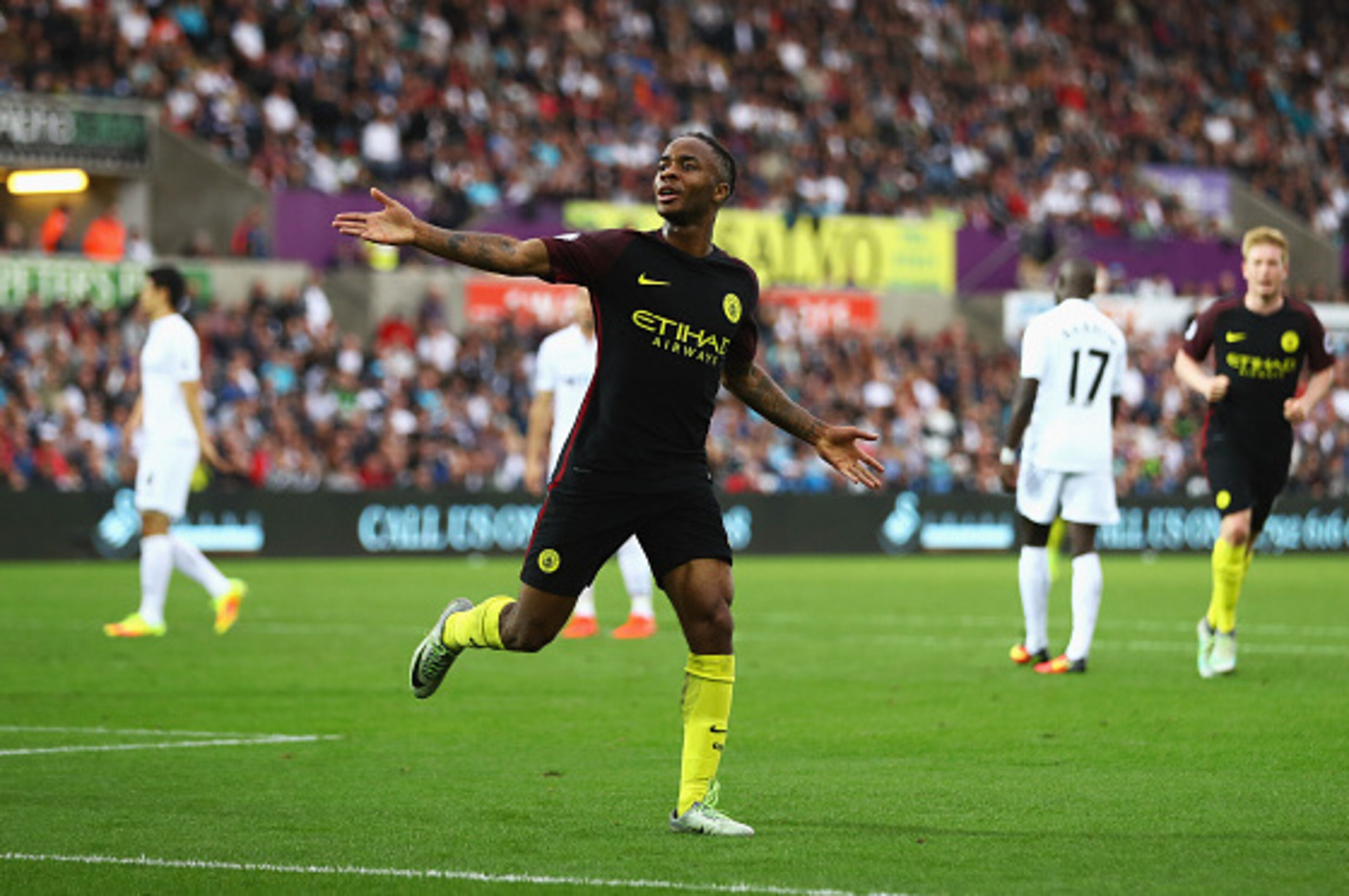 SWANSEA, WALES - SEPTEMBER 24:  Raheem Sterling of Manchester City celebrates scoring his sides third goal during the Premier League match between Swansea City and Manchester City at the Liberty Stadium on September 24, 2016 in Swansea, Wales.  (Photo by 
