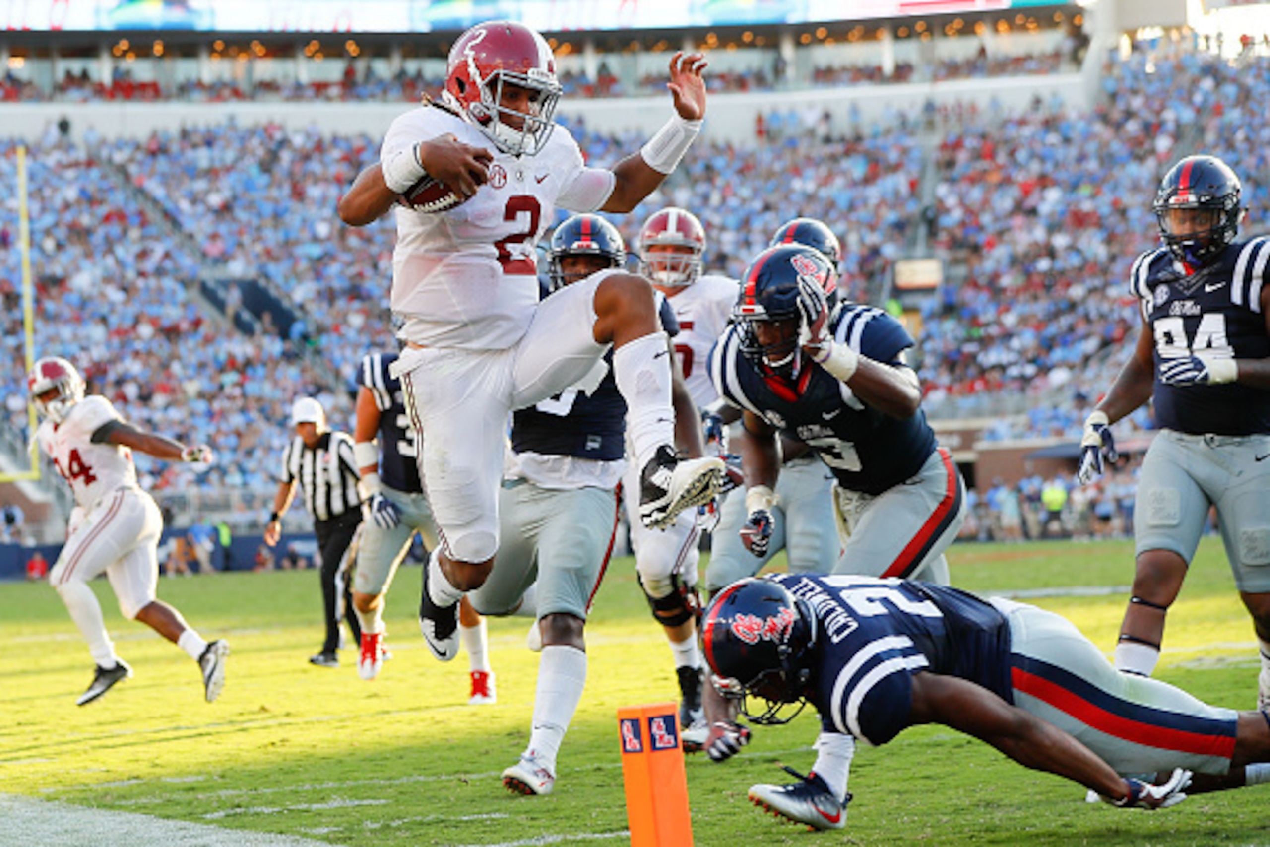 OXFORD, MS - SEPTEMBER 17:  Jalen Hurts #2 of the Alabama Crimson Tide leaps over Terry Caldwell #21 of the Mississippi Rebels at Vaught-Hemingway Stadium on September 17, 2016 in Oxford, Mississippi.  (Photo by Kevin C. Cox/Getty Images)