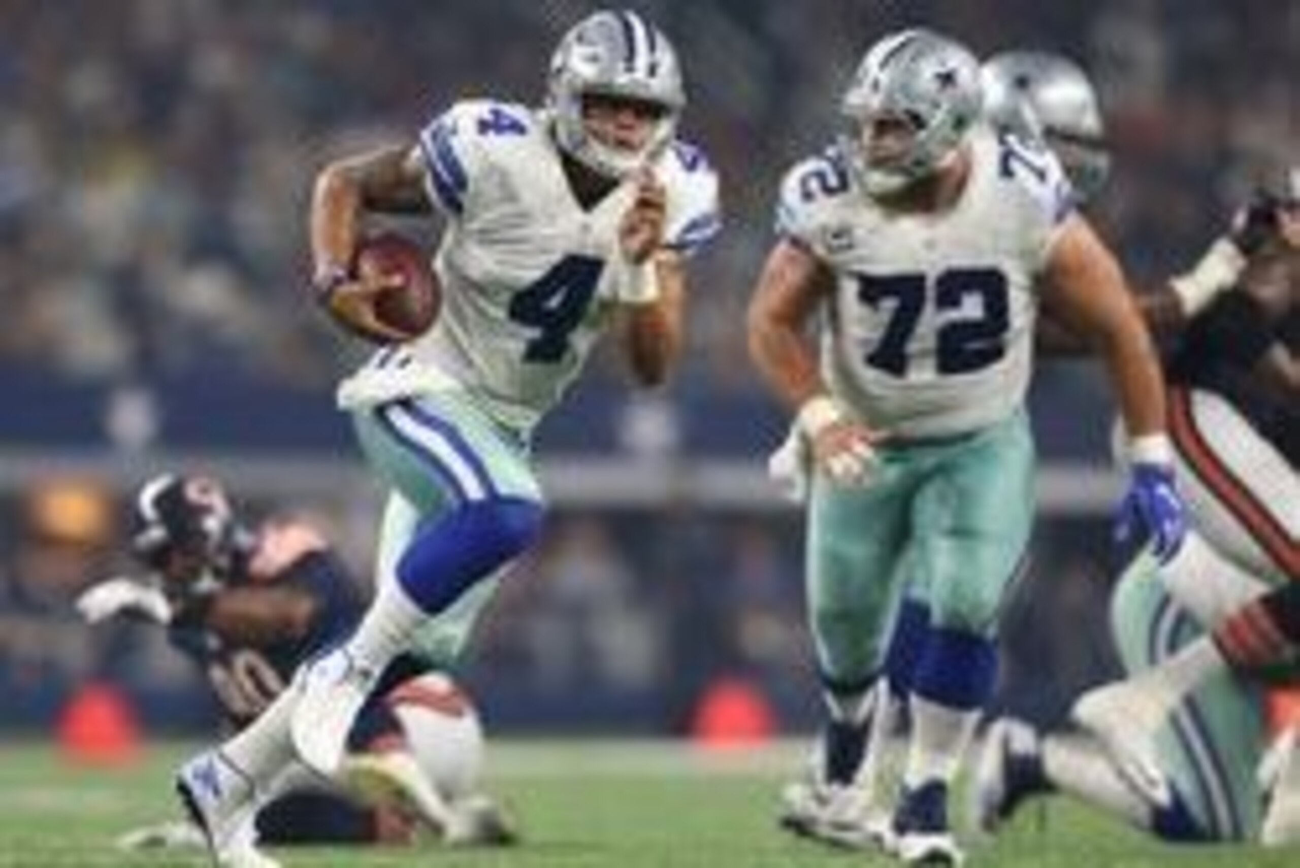 Sep 25, 2016; Arlington, TX, USA; Dallas Cowboys quarterback Dak Prescott (4) scrambles in the second quarter against the Chicago Bears at AT&T Stadium. Mandatory Credit: Matthew Emmons-USA TODAY Sports