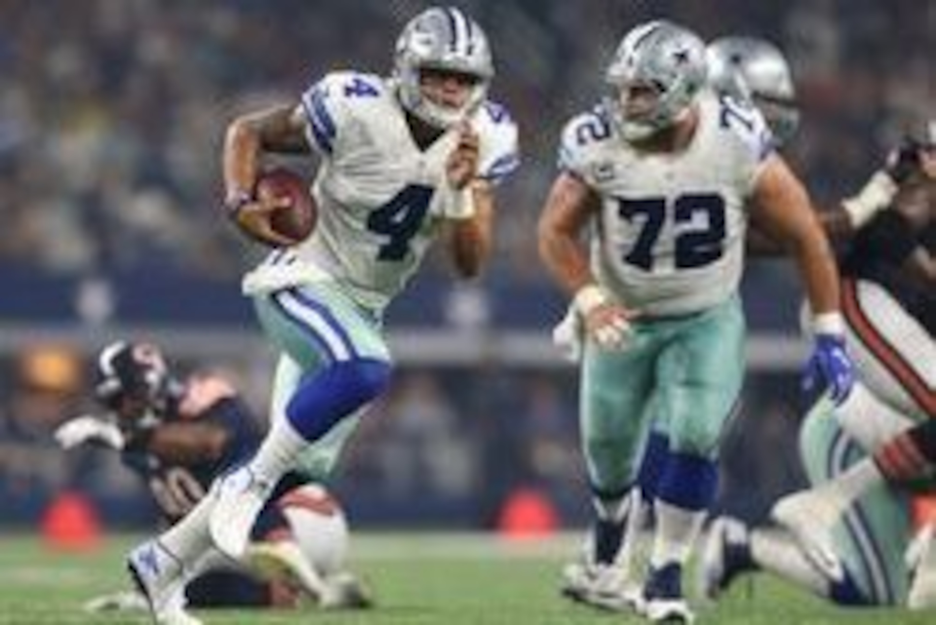 Sep 25, 2016; Arlington, TX, USA; Dallas Cowboys quarterback Dak Prescott (4) scrambles in the second quarter against the Chicago Bears at AT&T Stadium. Mandatory Credit: Matthew Emmons-USA TODAY Sports