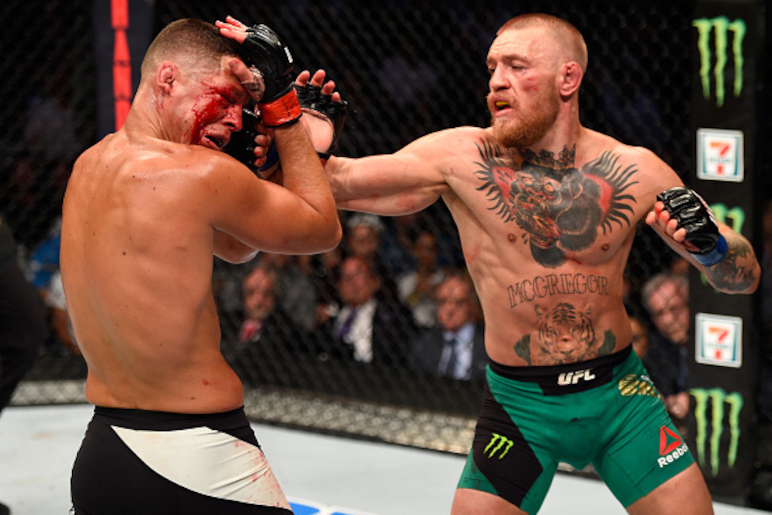LAS VEGAS, NV - AUGUST 20:   (R-L) Conor McGregor of Ireland punches Nate Diaz in their welterweight bout during the UFC 202 event at T-Mobile Arena on August 20, 2016 in Las Vegas, Nevada. (Photo by Josh Hedges/Zuffa LLC/Zuffa LLC via Getty Images)