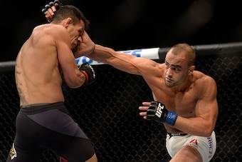 LAS VEGAS, NV - JULY 07:   (R-L) Eddie Alvarez punches Rafael Dos Anjos of Brazil in their lightweight championship bout during the UFC Fight Night event inside the MGM Grand Garden Arena on July 7, 2016 in Las Vegas, Nevada. (Photo by Brandon Magnus/Zuff