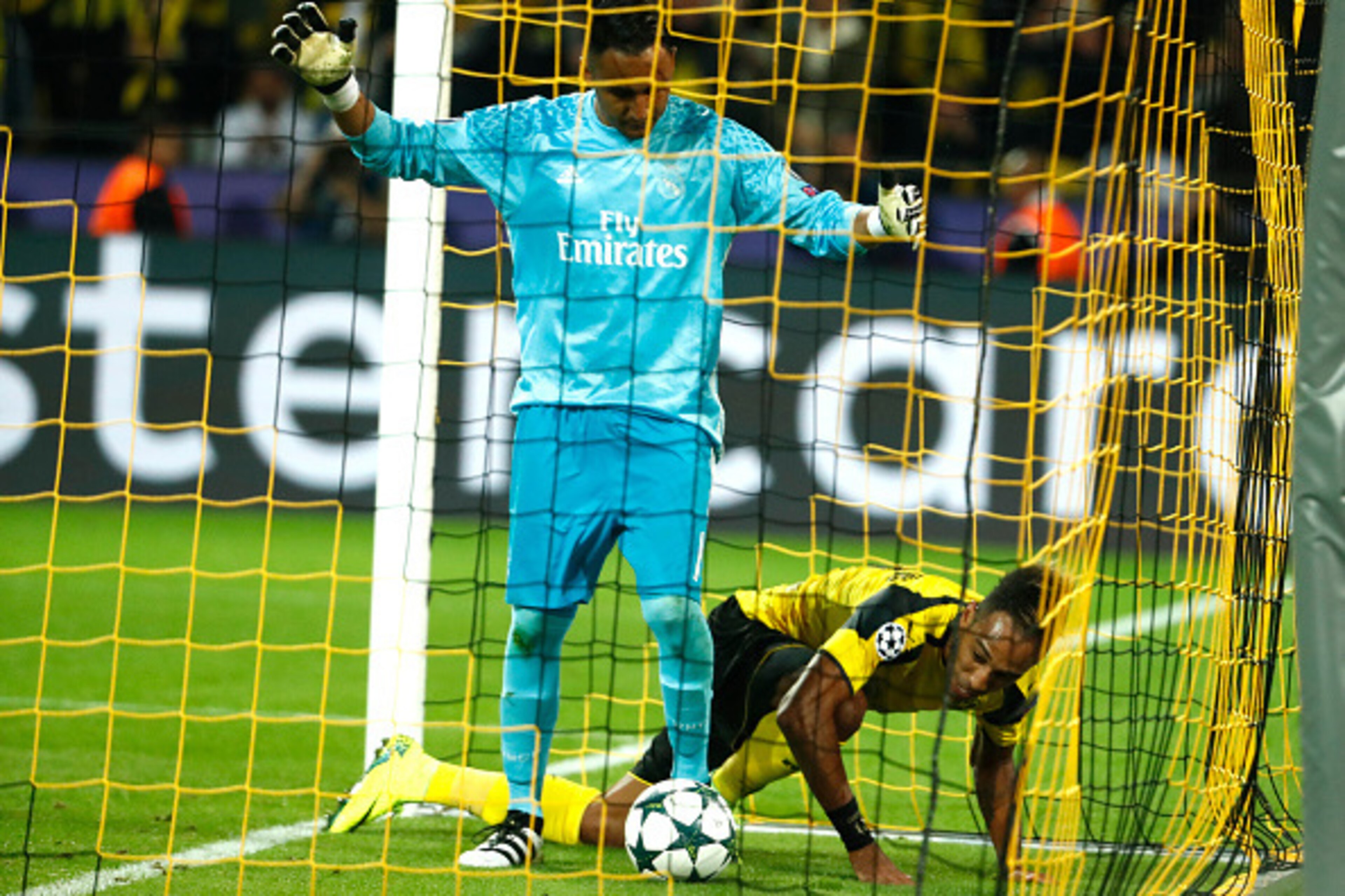 Dortmund's Gabonese forward Pierre-Emerick Aubameyang reacts after scoring past Real Madrid's Costa Rican goalkeeper Keylor Navas during the UEFA Champions League first leg football match between Borussia Dortmund and Real Madrid at BVB stadium in Dortmun