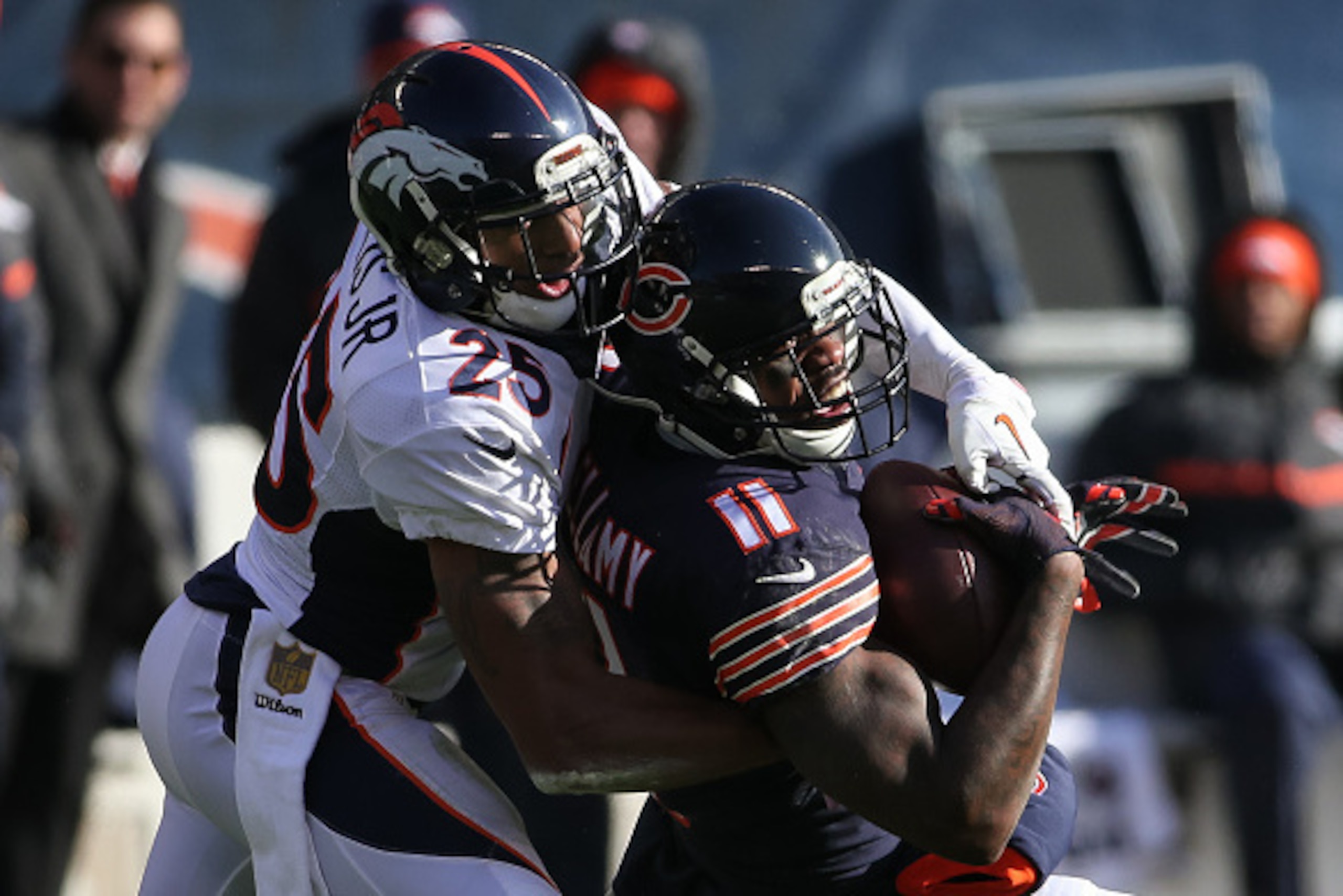 CHICAGO, IL - NOVEMBER 22:  Chris Harris #25 of the Denver Broncos tackles  Josh Bellamy #11 of the Chicago Bears in the second quarter at Soldier Field on November 22, 2015 in Chicago, Illinois.  (Photo by Jonathan Daniel/Getty Images)