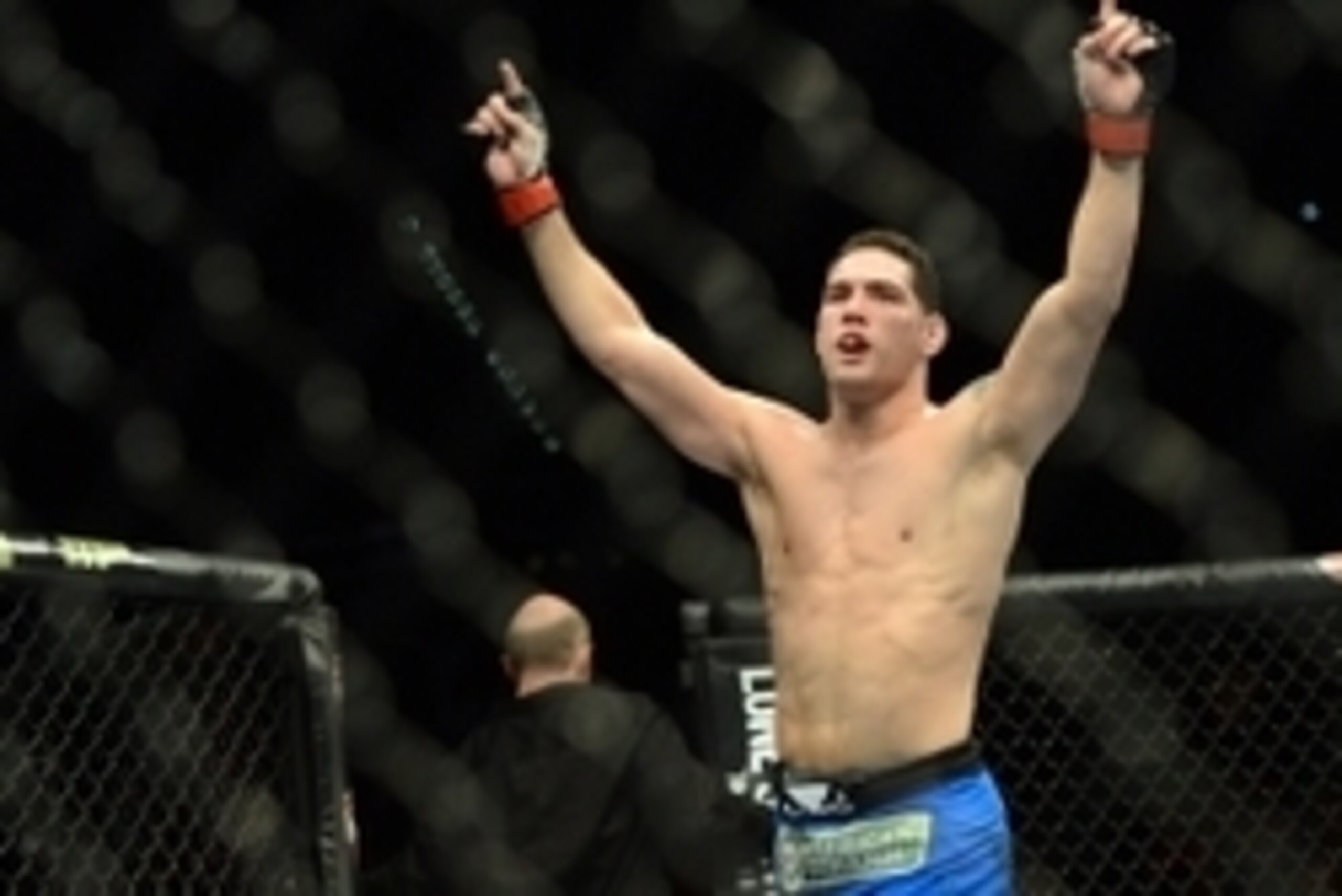 Dec 28, 2013; Las Vegas, NV, USA;    Chris Weidman reacts in the cage after defeating Anderson Silva (not pictured) in their UFC middleweight championship bout at the MGM Grand Garden Arena. Mandatory Credit: Jayne Kamin-Oncea-USA TODAY Sports