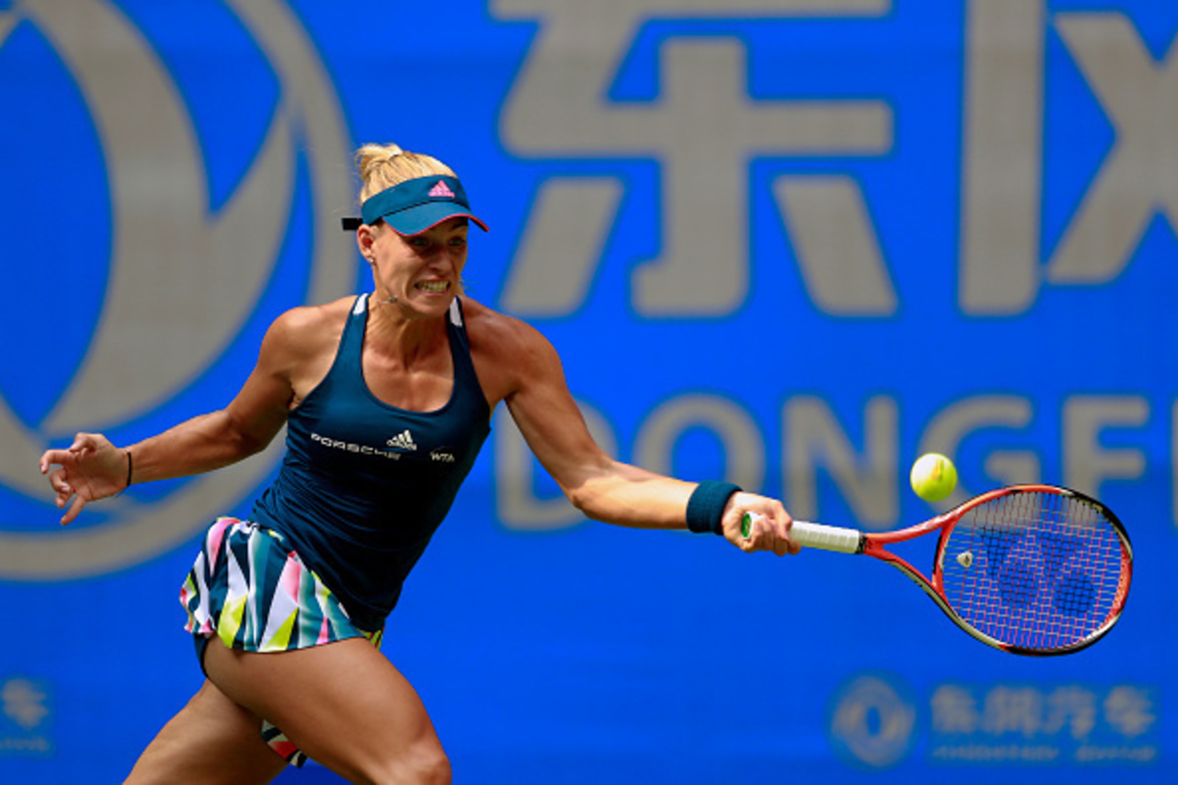 WUHAN, CHINA - SEPTEMBER 27: Angelique Kerber of Germany returns a shot to Kristina Mladenovic of France during their third round match on Day three of the 2016 Dongfeng Motor Wuhan Open at the Optics Valley International Tennis Center on September 27, 20
