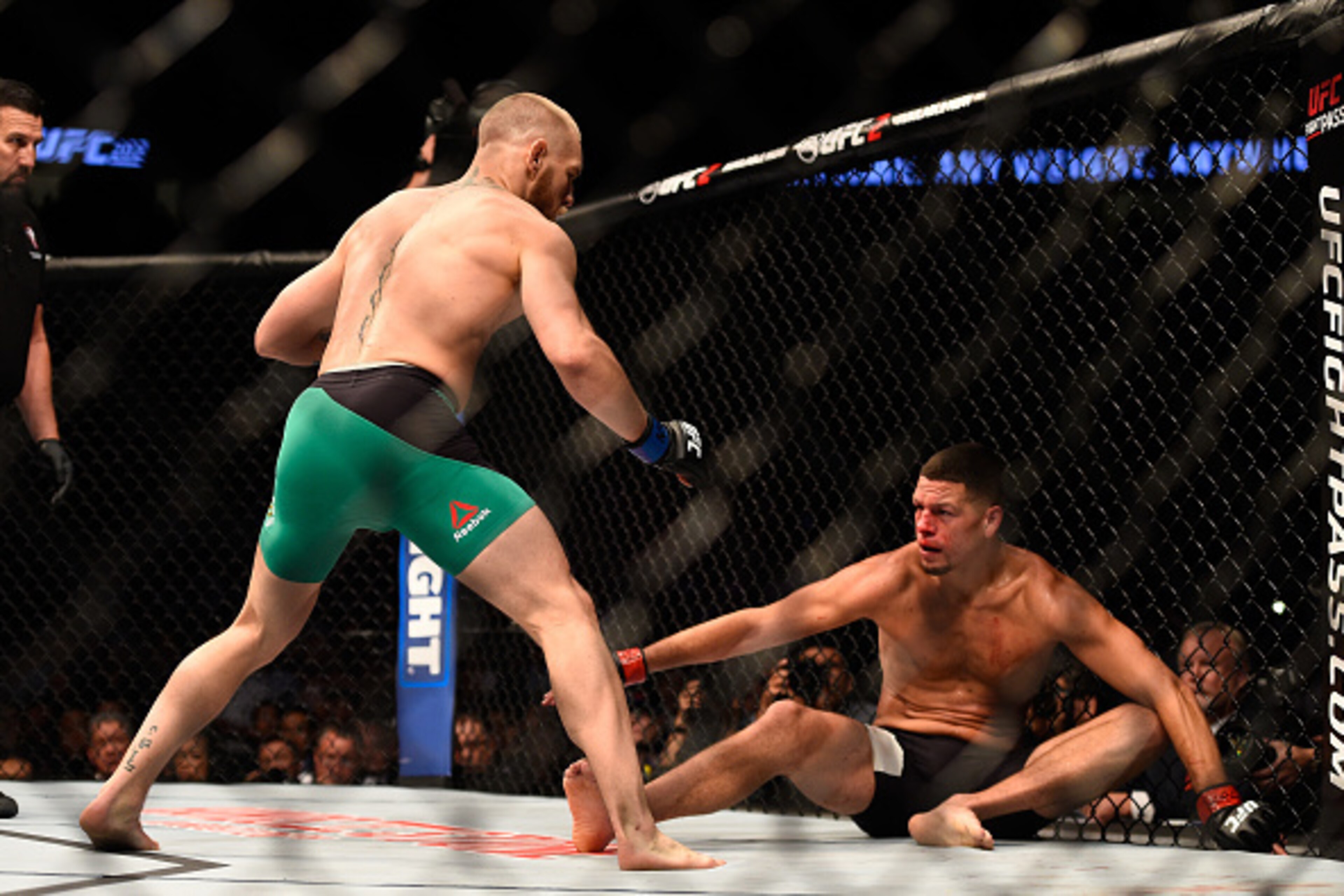 LAS VEGAS, NV - AUGUST 20: (L-R) Conor McGregor of Ireland knocks down Nate Diaz in their welterweight bout during the UFC 202 event at T-Mobile Arena on August 20, 2016 in Las Vegas, Nevada. (Photo by Jeff Bottari/Zuffa LLC/Zuffa LLC via Getty Images) LAS VEGAS, NV - AUGUST 20: (L-R) Conor McGregor of Ireland knocks down Nate Diaz in their welterweight bout during the UFC 202 event at T-Mobile Arena on August 20, 2016 in Las Vegas, Nevada. (Photo by Jeff Bottari/Zuffa LLC/Zuffa LLC via Getty Images)