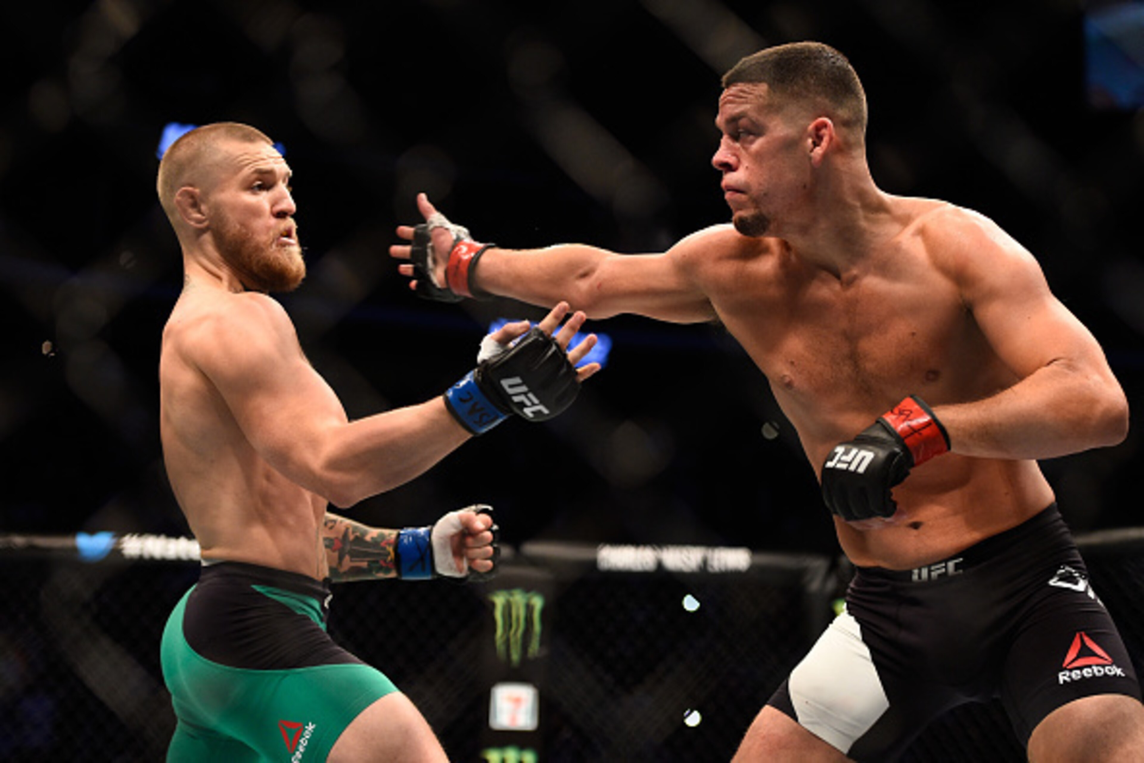 LAS VEGAS, NV - AUGUST 20: (R-L) Nate Diaz attempts to strike Conor McGregor of Ireland in their welterweight bout during the UFC 202 event at T-Mobile Arena on August 20, 2016 in Las Vegas, Nevada. (Photo by Jeff Bottari/Zuffa LLC/Zuffa LLC via Getty Im LAS VEGAS, NV - AUGUST 20: (R-L) Nate Diaz attempts to strike Conor McGregor of Ireland in their welterweight bout during the UFC 202 event at T-Mobile Arena on August 20, 2016 in Las Vegas, Nevada. (Photo by Jeff Bottari/Zuffa LLC/Zuffa LLC via Getty Im