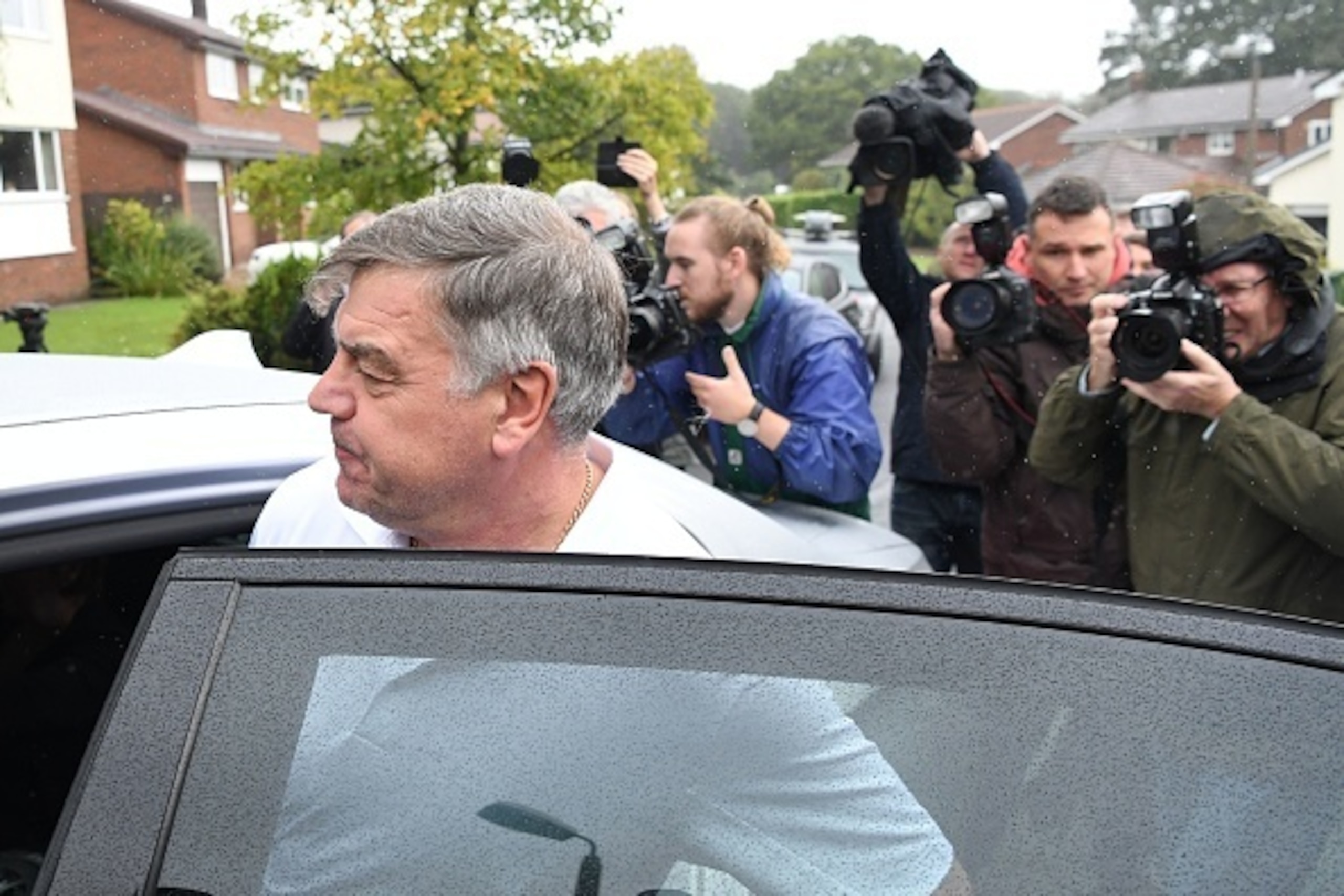 Former England national football team manager Sam Allardyce walks out of his home in Bolton on September 28, 2016.
Sam Allardyce admitted an 'error of judgment' today after his career as England manager came to a humiliating end following controversial co