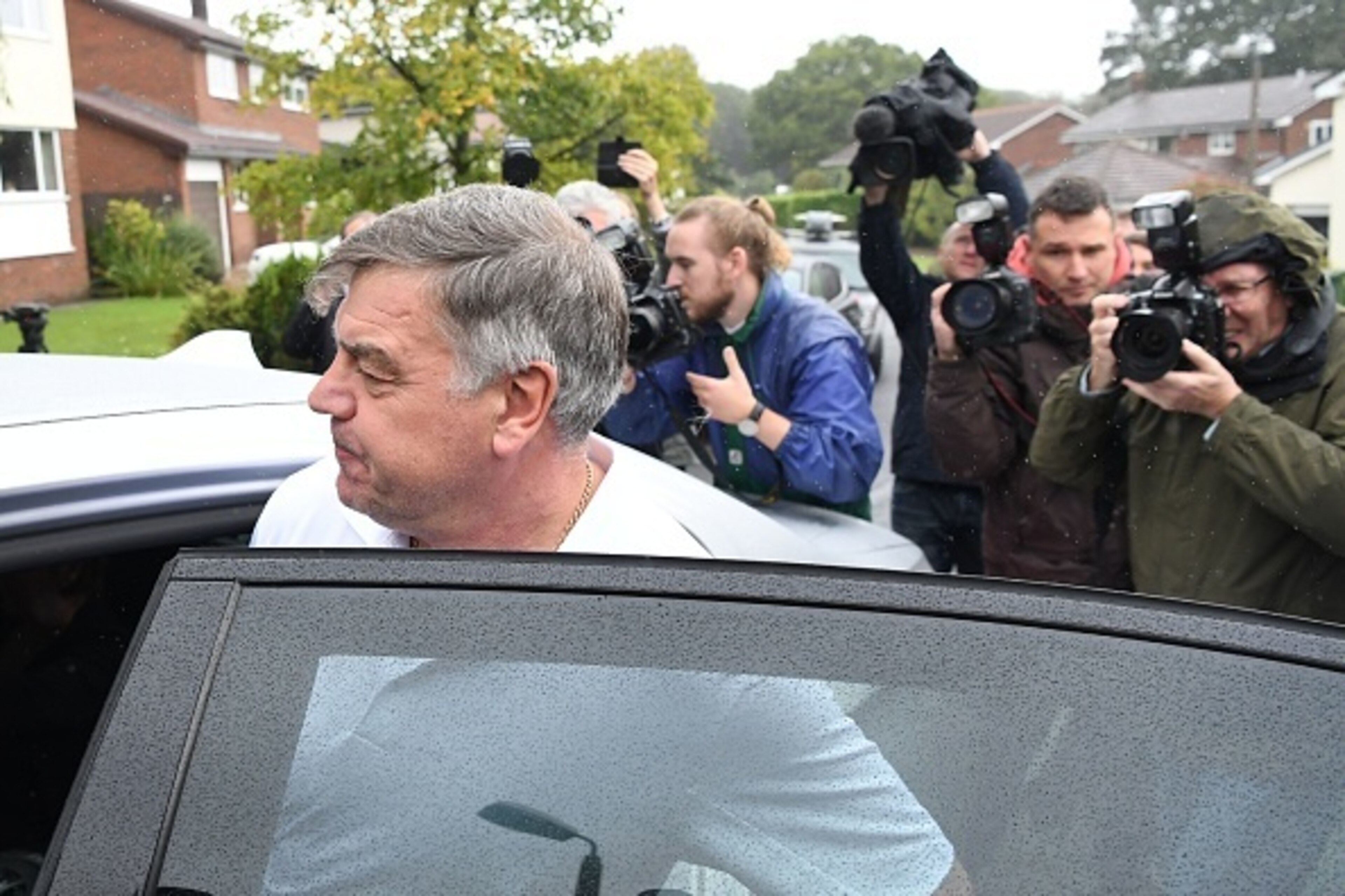 Former England national football team manager Sam Allardyce walks out of his home in Bolton on September 28, 2016.
Sam Allardyce admitted an 'error of judgment' today after his career as England manager came to a humiliating end following controversial co