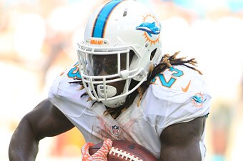 MIAMI GARDENS, FL - SEPTEMBER 25:  Jay Ajayi #23 of the Miami Dolphins scores the winning touchdown against the Cleveland Browns in the first quarter on September 25, 2016 in Miami Gardens, Florida. Miami defeated Cleveland 30-24.  (Photo by Marc Serota/G