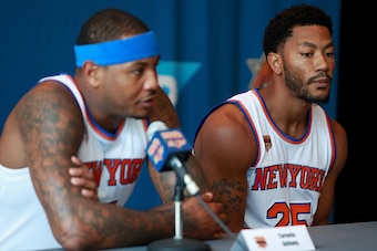 WHITE PLAINS, NY - SEPTEMBER 26:  Derrick Rose #25 of the New York Knicks looks on as Carmelo Anthony #7 addresses the media during the New York Knicks Media Day at the Ritz Carlton on September 26, 2016 in White Plains, New York.  (Photo by Michael Reave