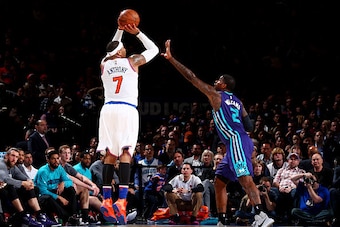NEW YORK, NY - APRIL 6:  Carmelo Anthony #7 of the New York Knicks shoots against Marvin Williams #2 of the Charlotte Hornets on April 6, 2016 at Madison Square Garden in New York City.  NOTE TO USER: User expressly acknowledges and agrees that, by downlo