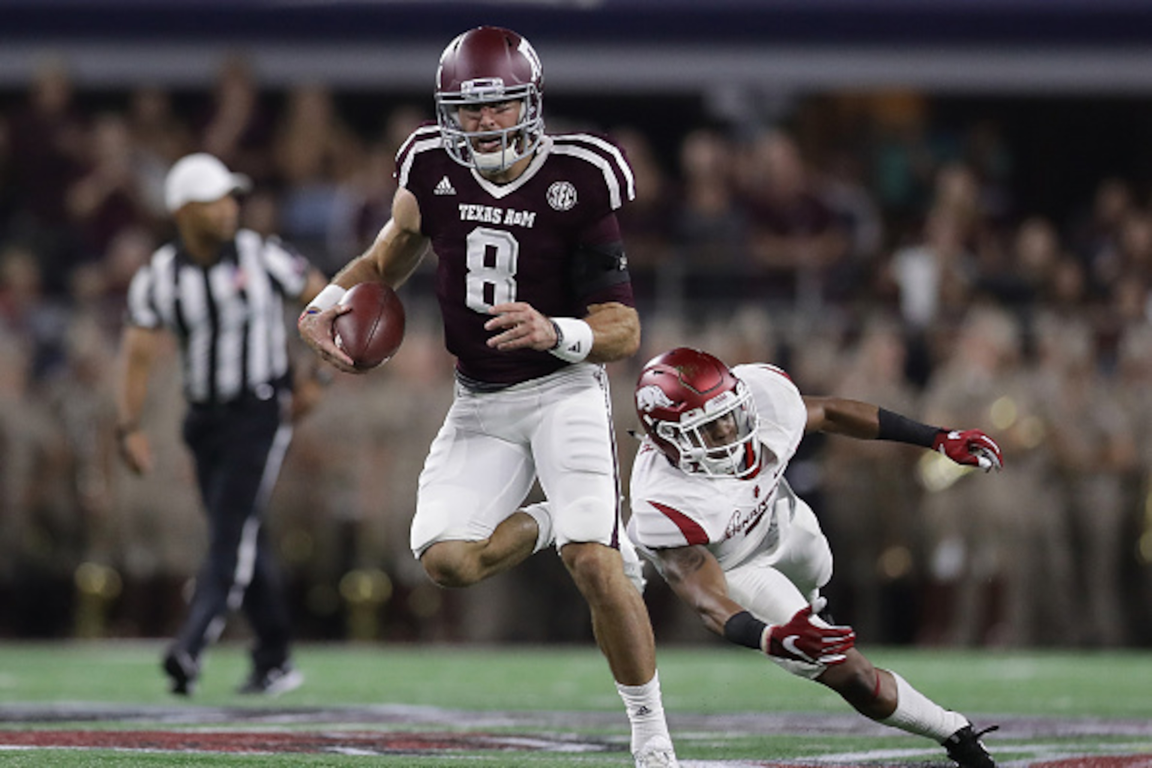 ARLINGTON, TX - SEPTEMBER 24:  Trevor Knight #8 of the Texas A&M Aggies runs the ball against the Arkansas Razorbacks in the second quarter at AT&T Stadium on September 24, 2016 in Arlington, Texas.  (Photo by Ronald Martinez/Getty Images)