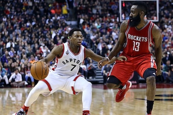 TORONTO, ON - MARCH 06:  Kyle Lowry #7 of the Toronto Raptors dribbles the ball as James Harden #13 of the Houston Rockets defends during the second half of an NBA game at the Air Canada Centre on March 06, 2016 in Toronto, Ontario, Canada.  NOTE TO USER: