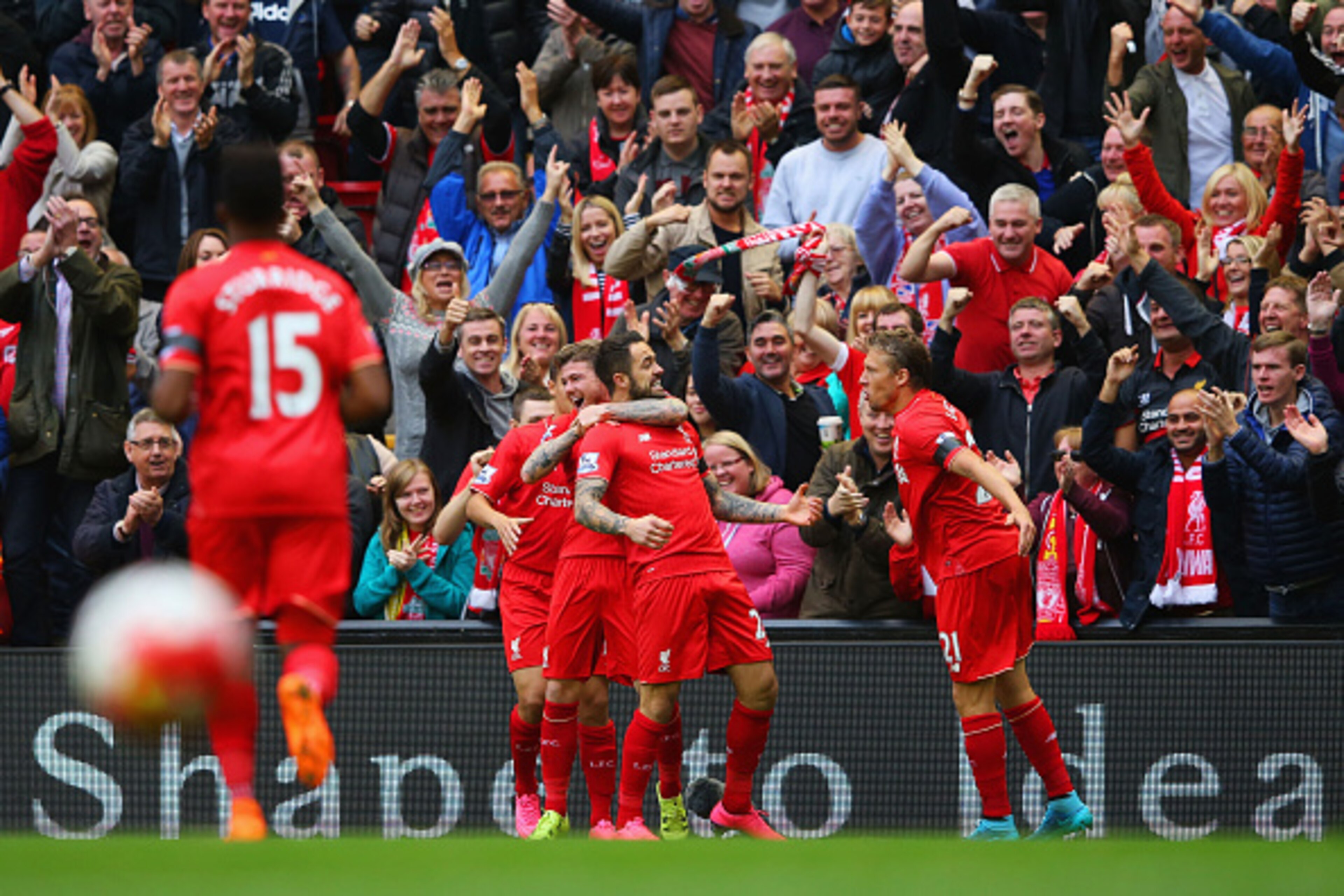 LIVERPOOL, ENGLAND - SEPTEMBER 20:  Danny Ings of Liverpool (28) celebrates with in front of fans with  team mates as he scores their first goal during the Barclays Premier League match between Liverpool and Norwich City at Anfield on September 20, 2015 i
