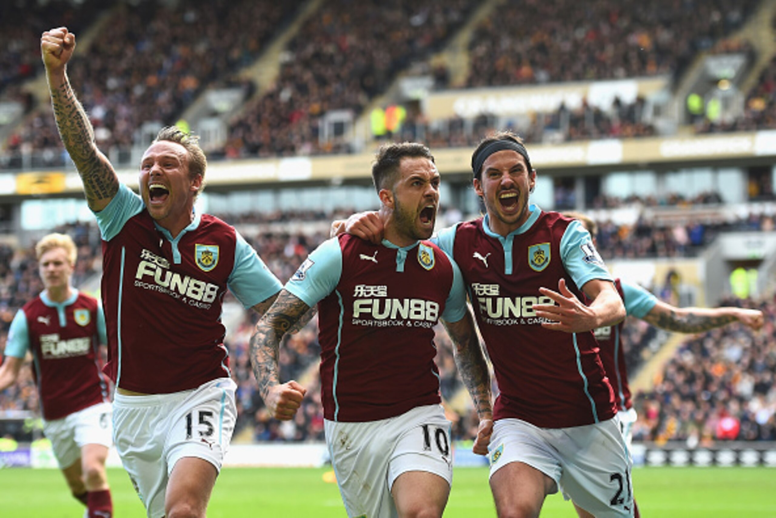 HULL, ENGLAND - MAY 09:  Danny Ings (C) of Burnley celebrates scoring the opening goal with Matthew Taylor (L) and George Boyd of Burnley during the Barclays Premier League match between Hull City and Burnley at KC Stadium on May 9, 2015 in Hull, England.