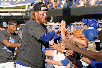 LOS ANGELES, CA - SEPTEMBER 25:   Justin Turner #10 of the Los Angeles Dodgers greets fans after a 4-3 win over the Colorado Rockies during the tenth inning at Dodger Stadium on September 25, 2016 in Los Angeles, California. The Los Angeles Dodgers clinch