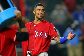 ARLINGTON, TX - SEPTEMBER 19: Ian Desmond #20 of the Texas Rangers looks on before having the coolers dumped on him in celebration of his walk off single in the ninth inning against the Los Angeles Angels of Anaheim at Globe Life Park in Arlington on Sept