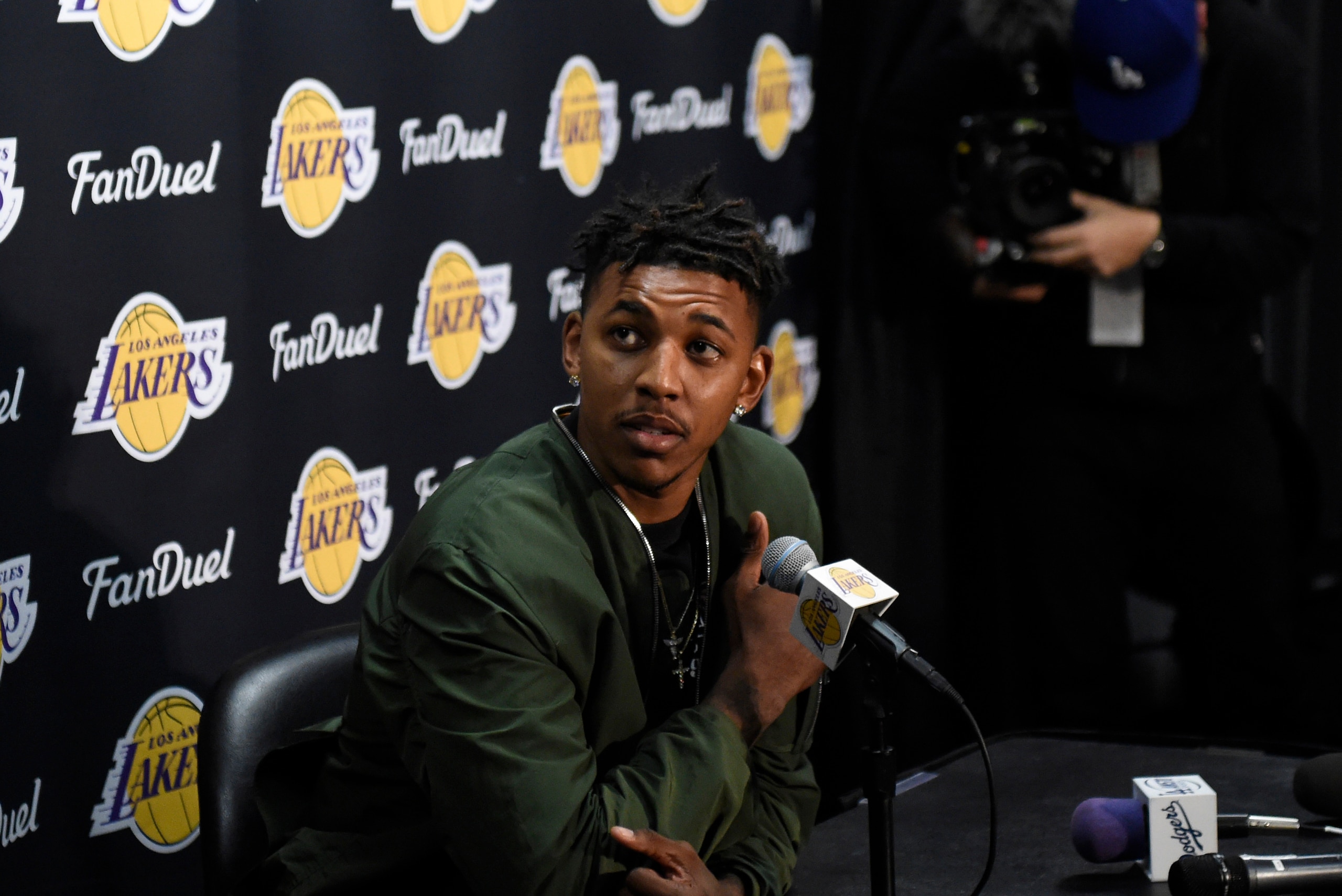 Mar 30, 2016; Los Angeles, CA, USA; Los Angeles Lakers forward Nick Young (0) at press conference related to guard D'Angelo Russell (1) at Staples Center. Mandatory Credit: Richard Mackson-USA TODAY Sports Mar 30, 2016; Los Angeles, CA, USA; Los Angeles Lakers forward Nick Young (0) at press conference related to guard D'Angelo Russell (1) at Staples Center. Mandatory Credit: Richard Mackson-USA TODAY Sports