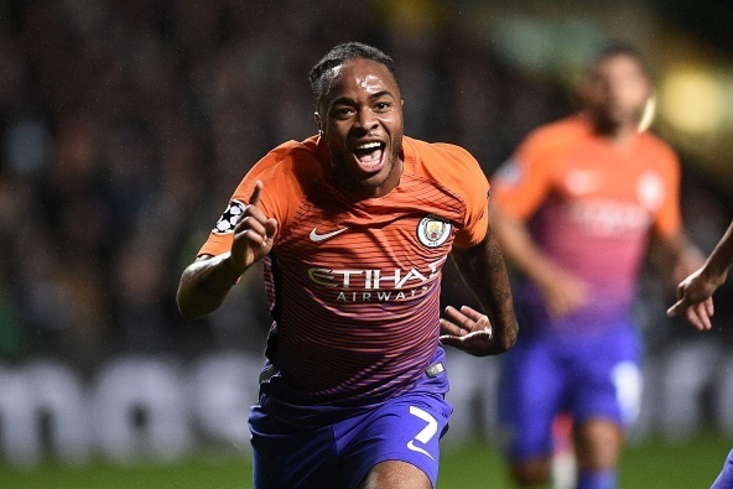 Manchester City's English midfielder Raheem Sterling celebrates scoring his team's second goal during the UEFA Champions League Group C football match between Celtic and Manchester City at Celtic Park stadium in Glasgow, Scotland on September 28, 2016. / 