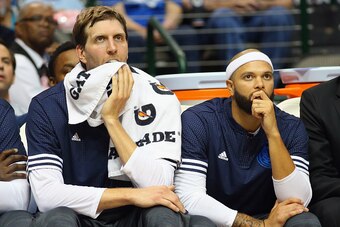 DALLAS, TX - OCTOBER 16:  Dirk Nowitzki #41 of the Dallas Mavericks and Deron Williams #8 sit on the bench during a preseason game against the Atlanta Hawks at American Airlines Center on October 16, 2015 in Dallas, Texas.  NOTE TO USER:  User expressly a
