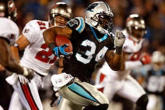 CHARLOTTE, NC - DECEMBER 08:  DeAngelo Williams #34 of the Carolina Panthers runs with the ball during their game against the Tampa Bay Buccaneers at Bank of America Stadium on December 8, 2008 in Charlotte, North Carolina.  (Photo by Streeter Lecka/Getty