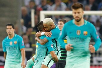 Neymar hugs Arda Turan after the Turk's goal.