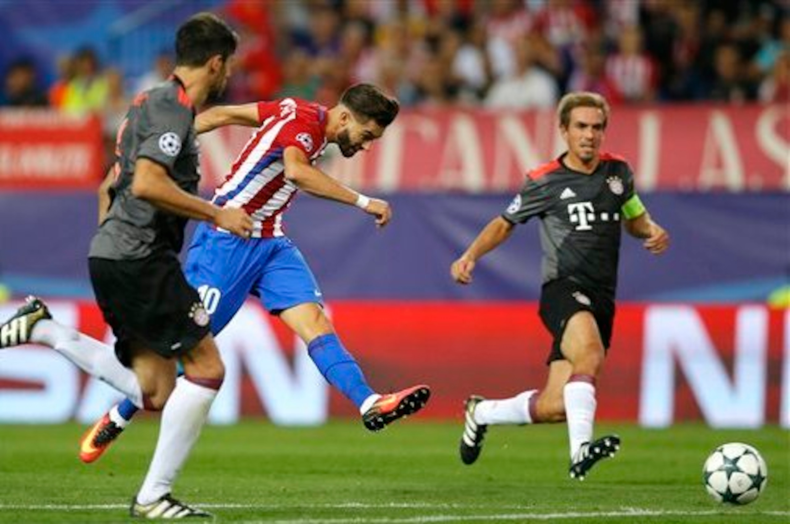 Carrasco's (2nd l.) first-half goal proved enough to separate the sides.
