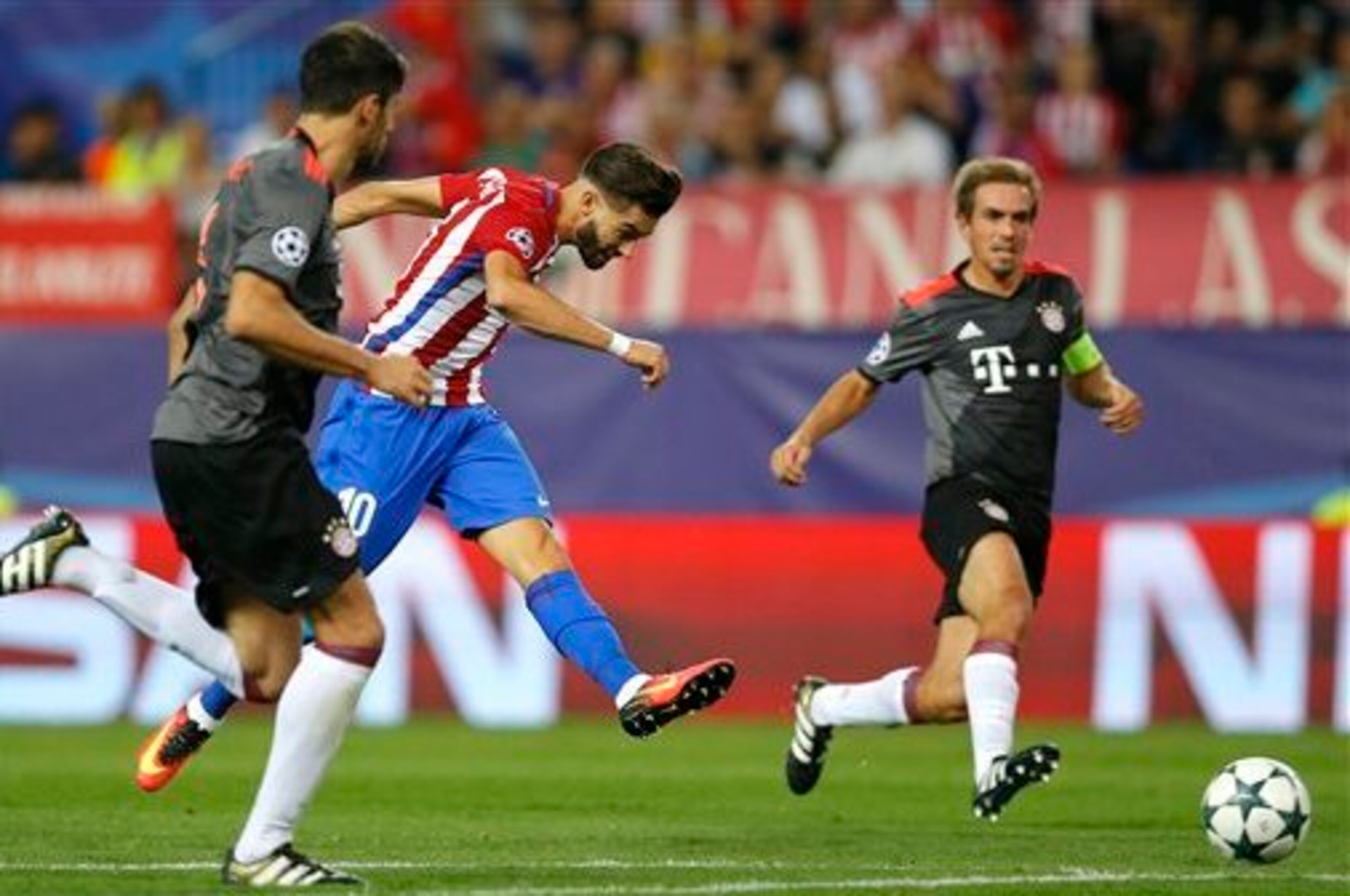 Carrasco's (2nd l.) first-half goal proved enough to separate the sides.