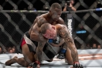 Jul 8, 2016; Las Vegas, NV, USA; Will Brooks (blue gloves) fights Ross Pearson (red gloves) during The Ultimate Fighter Finale at MGM Grand Garden Arena. Mandatory Credit: Joshua Dahl-USA TODAY Sports