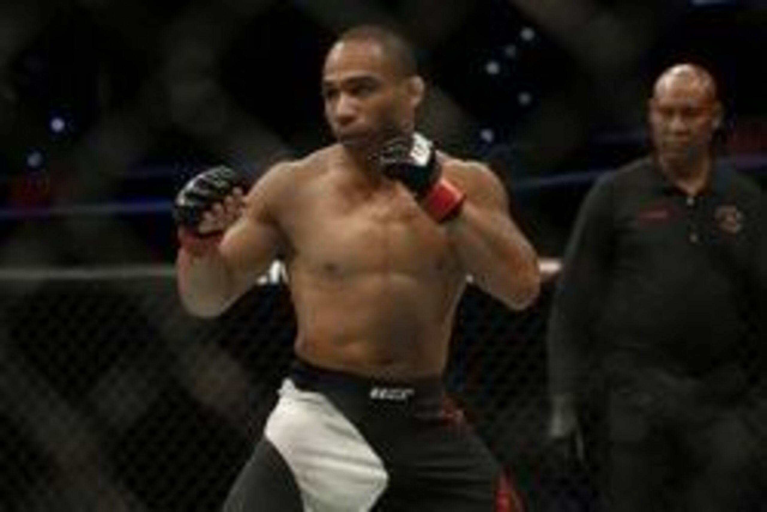 Apr 16, 2016; Tampa, FL, USA; John Dodson (red gloves) fights Manvel Gamburyana (not pictured) in the third bout during UFC Fight Night at Amalie Arena. Dodson Won at47 seconds in the first round. Mandatory Credit: Reinhold Matay-USA TODAY Sports
