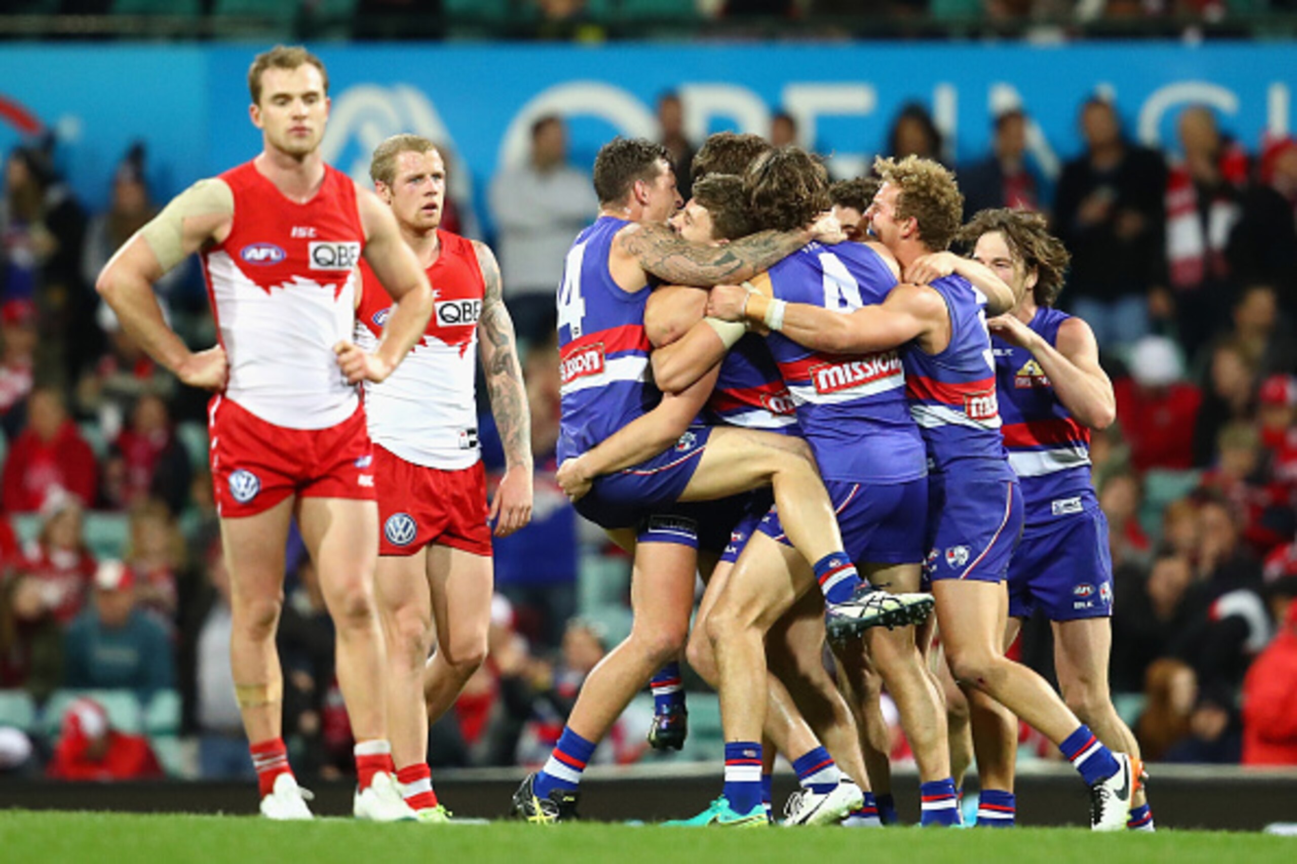 SYDNEY, AUSTRALIA - JULY 02:  Bulldogs players celebrate winning the round 15 AFL match between the Sydney Swans and the Western Bulldogs at Sydney Cricket Ground on July 2, 2016 in Sydney, Australia.  (Photo by Cameron Spencer/Getty Images)