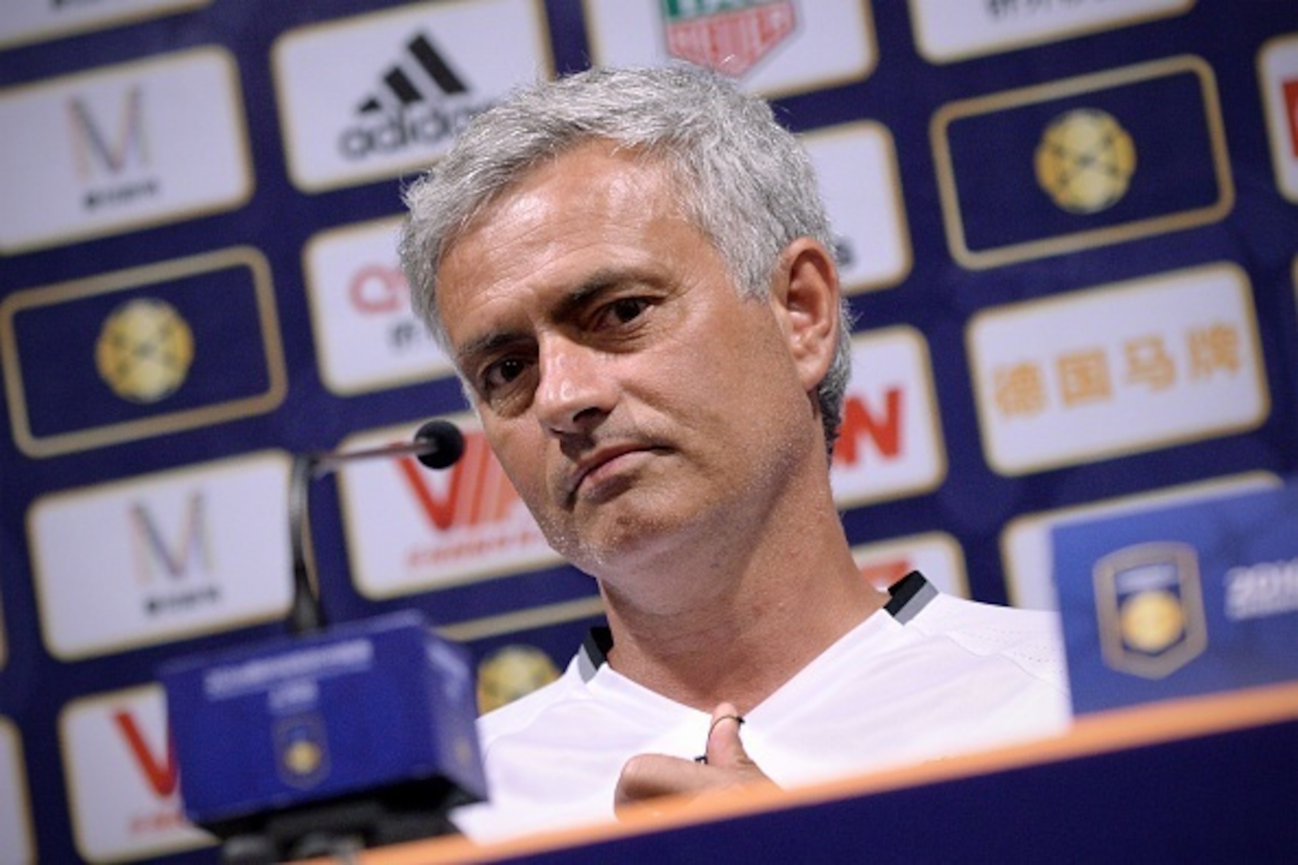 Manchester United's head coach Jose Mourinho looks on as he prepares to answer a question during a press conference ahead of the 2016 International Champions Cup football match between Manchester United and Dortmund in Shanghai on July 21, 2016. / AFP / W