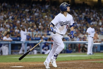 LOS ANGELES, CALIFORNIA - SEPTEMBER 24:  Josh Reddick #11 of the Los Angeles Dodgers drops his bat as he watches his grand slam home run in the seventh inning against the Colorado Rockies at Dodger Stadium on September 24, 2016 in Los Angeles, California.