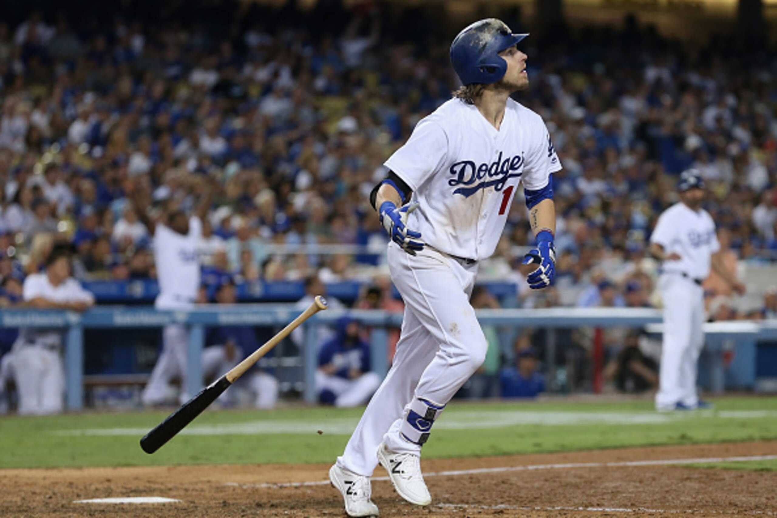 LOS ANGELES, CALIFORNIA - SEPTEMBER 24:  Josh Reddick #11 of the Los Angeles Dodgers drops his bat as he watches his grand slam home run in the seventh inning against the Colorado Rockies at Dodger Stadium on September 24, 2016 in Los Angeles, California.