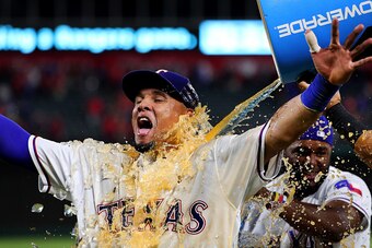 ARLINGTON, TX - SEPTEMBER 28:  Carlos Gomez #14 of the Texas Rangers is soaked with Powerade after hitting a three run home run off of Tyler Thornburg #37 of the Milwaukee Brewers in the bottom of the eighth inning to beat the Brewers 8-5 at Globe Life Pa