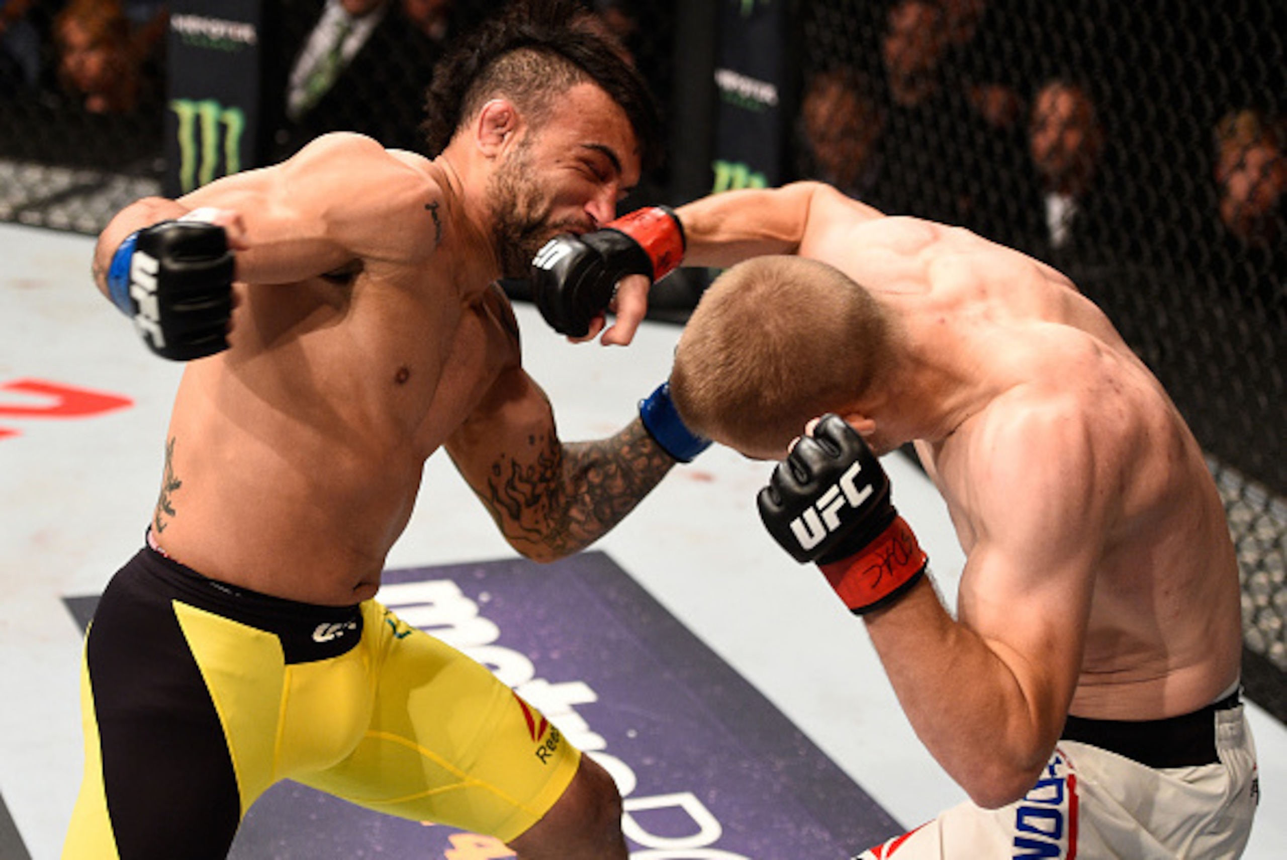 SIOUX FALLS, SD - JULY 13:   (R-L) Michael McDonald punches John Lineker in their bantamweight bout during the UFC Fight Night event on July 13, 2016 at Denny Sanford Premier Center in Sioux Falls, South Dakota. (Photo by Jeff Bottari/Zuffa LLC/Zuffa LLC 