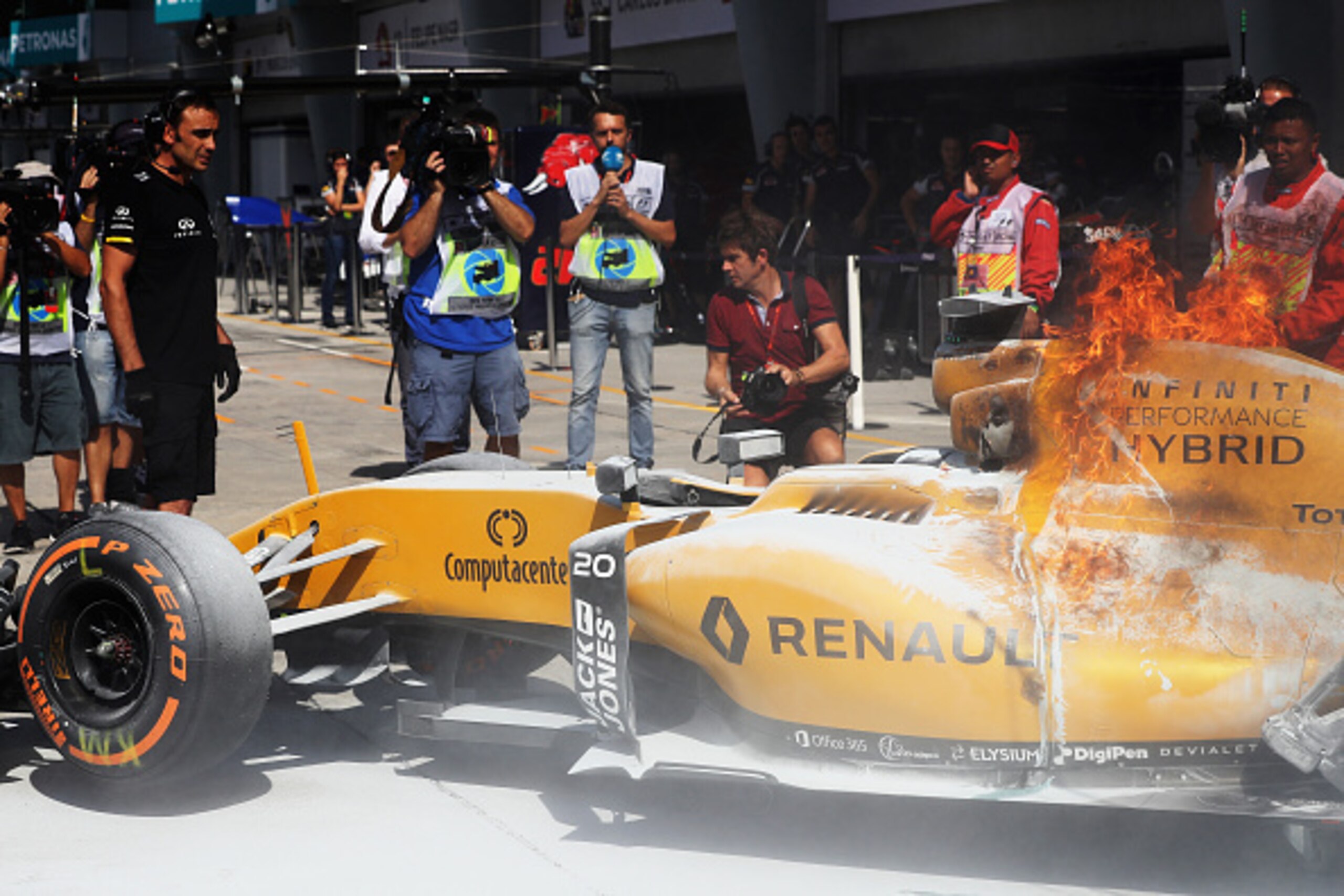 KUALA LUMPUR, MALAYSIA - SEPTEMBER 30:  The car of Kevin Magnussen of Denmark and Renault Sport F1 on fire in the Pitlane during practice for the Malaysia Formula One Grand Prix at Sepang Circuit on September 30, 2016 in Kuala Lumpur, Malaysia.  (Photo by