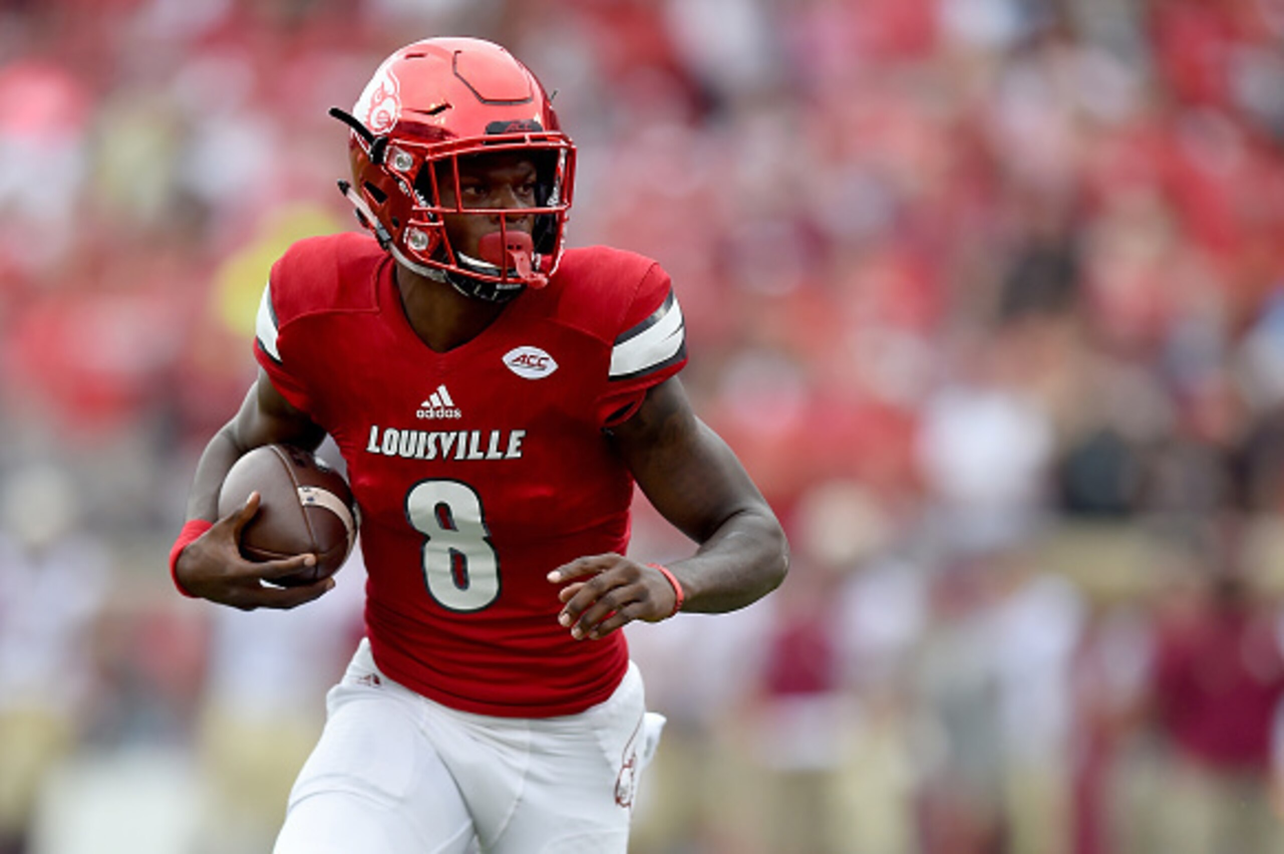 LOUISVILLE, KY - SEPTEMBER 17: Lamar Jackson #8 of the Louisville Cardinals runs with the ball during the game against the Florida State Seminoles at Papa John's Cardinal Stadium on September 17, 2016 in Louisville, Kentucky. (Photo by Bobby Ellis/Getty I