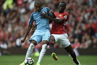 Manchester City's Brazilian midfielder Fernandinho (L) vies with Manchester United's Ivorian defender Eric Bailly during the English Premier League football match between Manchester United and Manchester City at Old Trafford in Manchester, north west Engl
