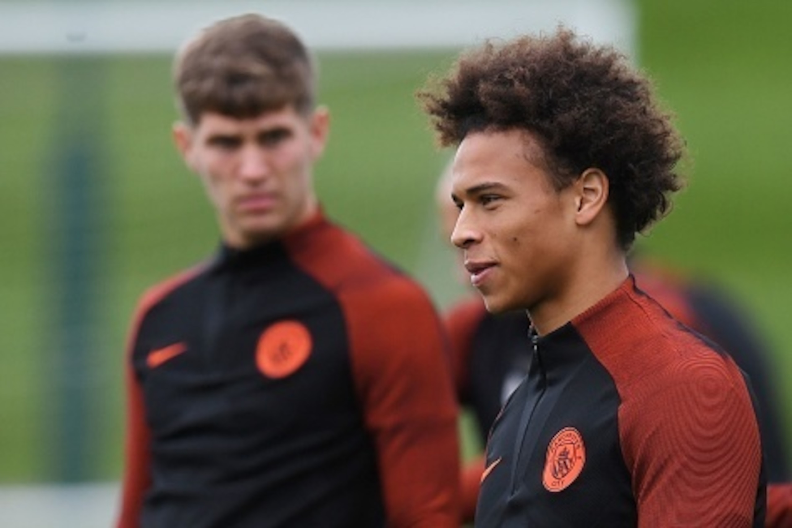 Manchester City's English defender John Stones (L) and Manchester City's German midfielder Leroy Sane attend a training session at the City Academy training complex in Manchester, north west England on September 12, 2016 ahead of their September 13 Champi