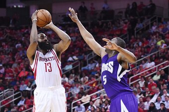 HOUSTON, TEXAS - APRIL 13:  James Harden #13 of the Houston Rockets shoots over James Anderson #5 of the Sacramento Kings during the first half of a game at the Toyota Center on April 13, 2016 in Houston, Texas. NOTE TO USER: User expressly acknowledges a