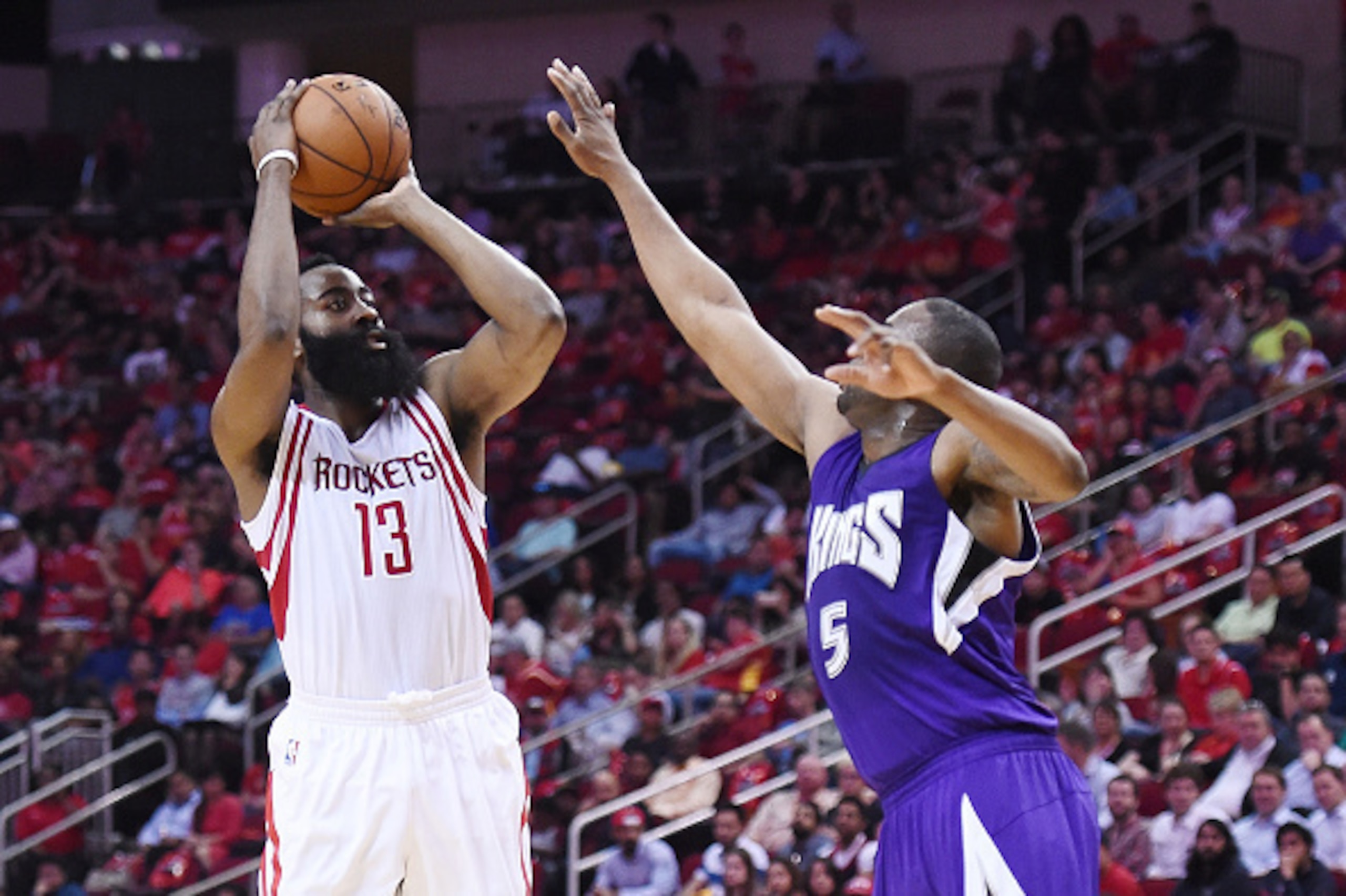 HOUSTON, TEXAS - APRIL 13:  James Harden #13 of the Houston Rockets shoots over James Anderson #5 of the Sacramento Kings during the first half of a game at the Toyota Center on April 13, 2016 in Houston, Texas. NOTE TO USER: User expressly acknowledges a