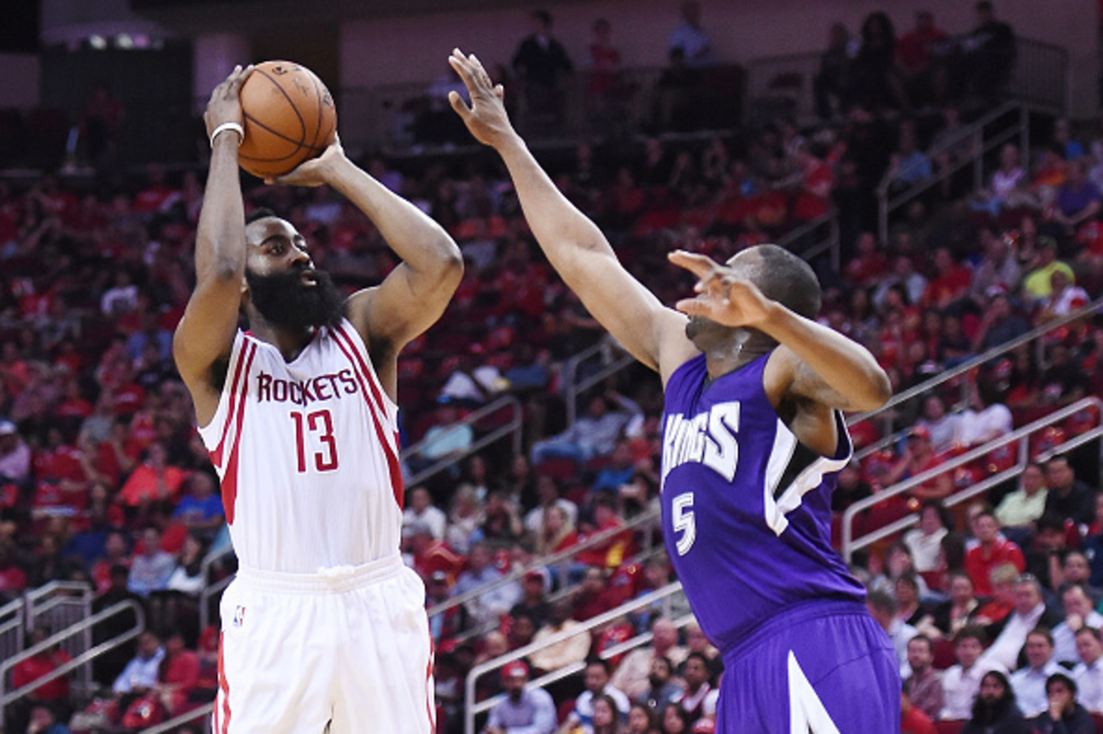 HOUSTON, TEXAS - APRIL 13:  James Harden #13 of the Houston Rockets shoots over James Anderson #5 of the Sacramento Kings during the first half of a game at the Toyota Center on April 13, 2016 in Houston, Texas. NOTE TO USER: User expressly acknowledges a