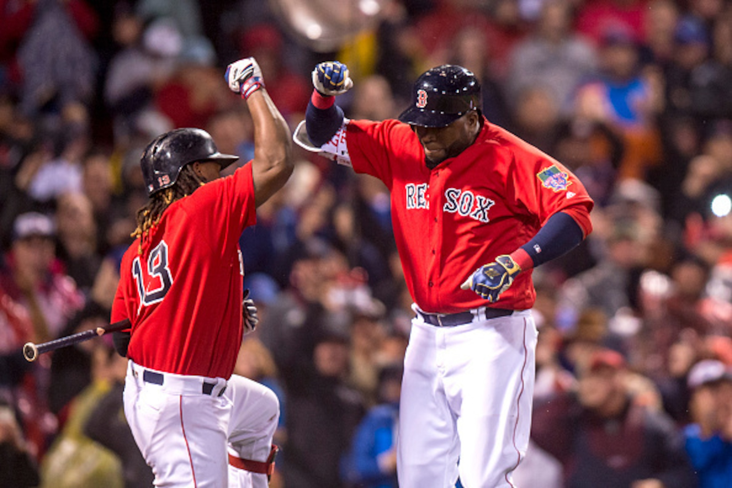 BOSTON, MA - SEPTEMBER 30: David Ortiz #34 of the Boston Red Sox high fives Hanley Ramirez #13 after hitting a go ahead two run home run during the seventh inning of a game against the Toronto Blue Jays on September 30, 2016 at Fenway Park in Boston, Mass BOSTON, MA - SEPTEMBER 30: David Ortiz #34 of the Boston Red Sox high fives Hanley Ramirez #13 after hitting a go ahead two run home run during the seventh inning of a game against the Toronto Blue Jays on September 30, 2016 at Fenway Park in Boston, Mass
