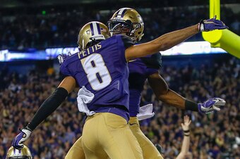 SEATTLE, WA - SEPTEMBER 30:  Wide receiver John Ross #1 of the Washington Huskies is congratulated by wide receiver Dante Pettis #8 after scoring a touchdown against the Stanford Cardinal in the second quarter on September 30, 2016 at Husky Stadium in Sea